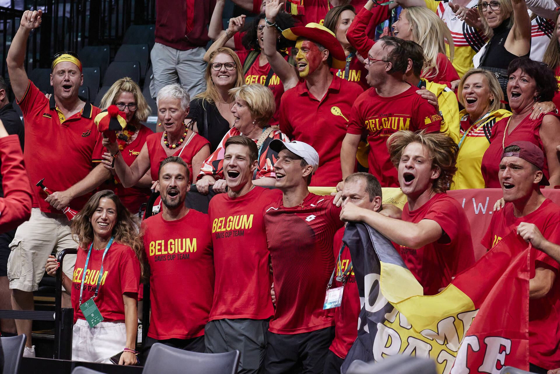 Zizou Bergs, Sander Gille and Joran Vliegen surrounded by Belgian fans