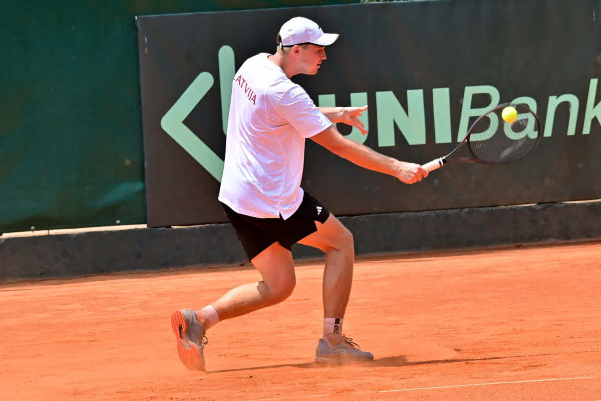Karlis Ozolins hits a backhand
