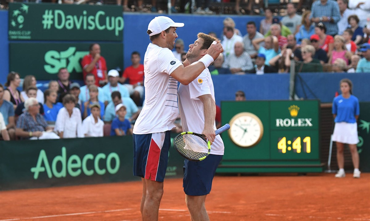 Bryan and Harrison win epic doubles to keep USA alive