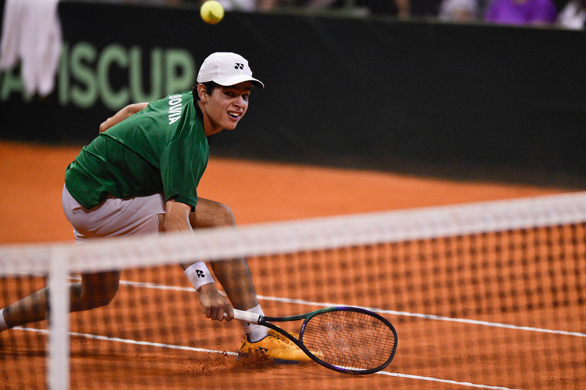 Juan Carlos Prado Angelo hits a volley