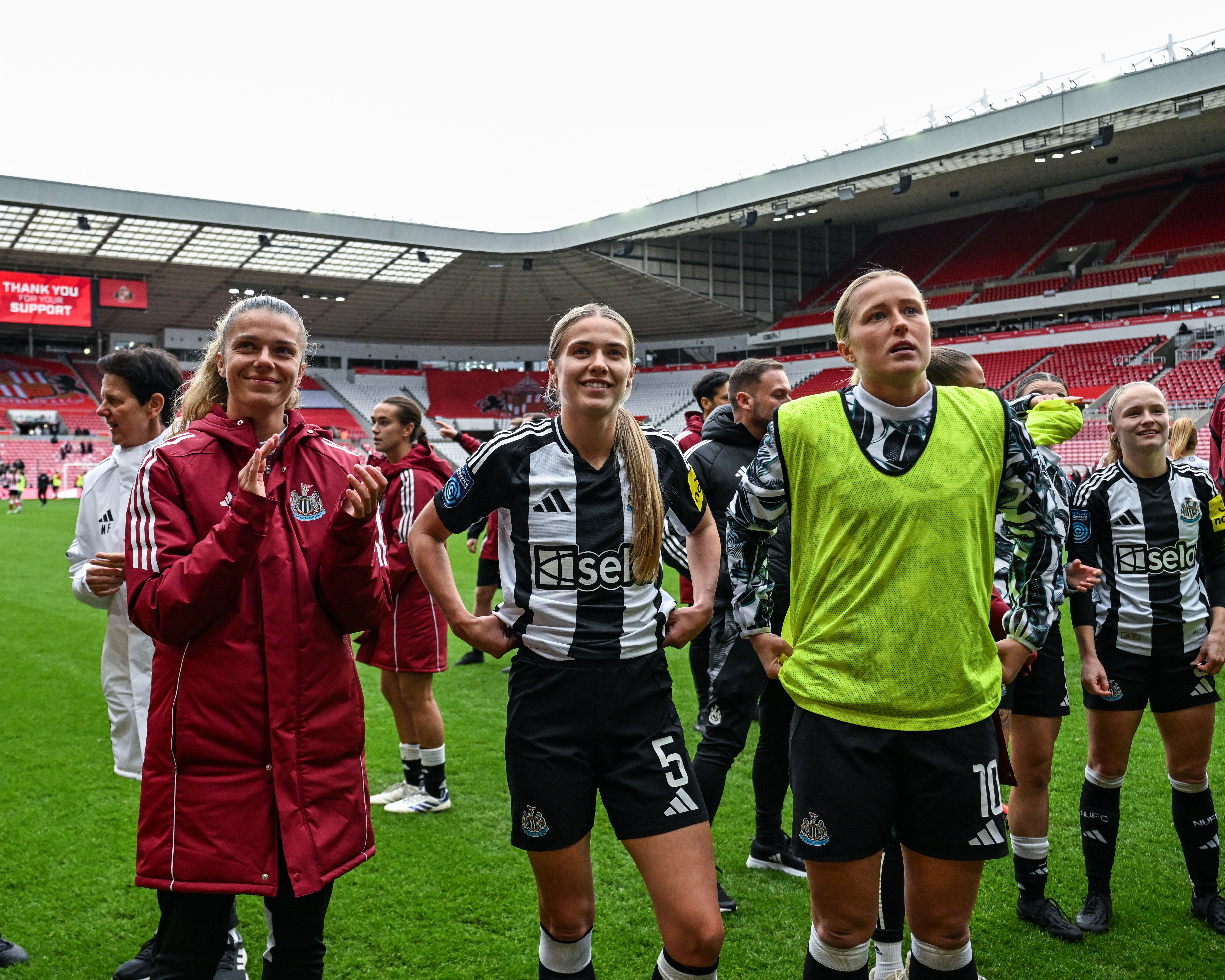 Liv Watt celebrates with Amy Andrews and Georgia Gibson