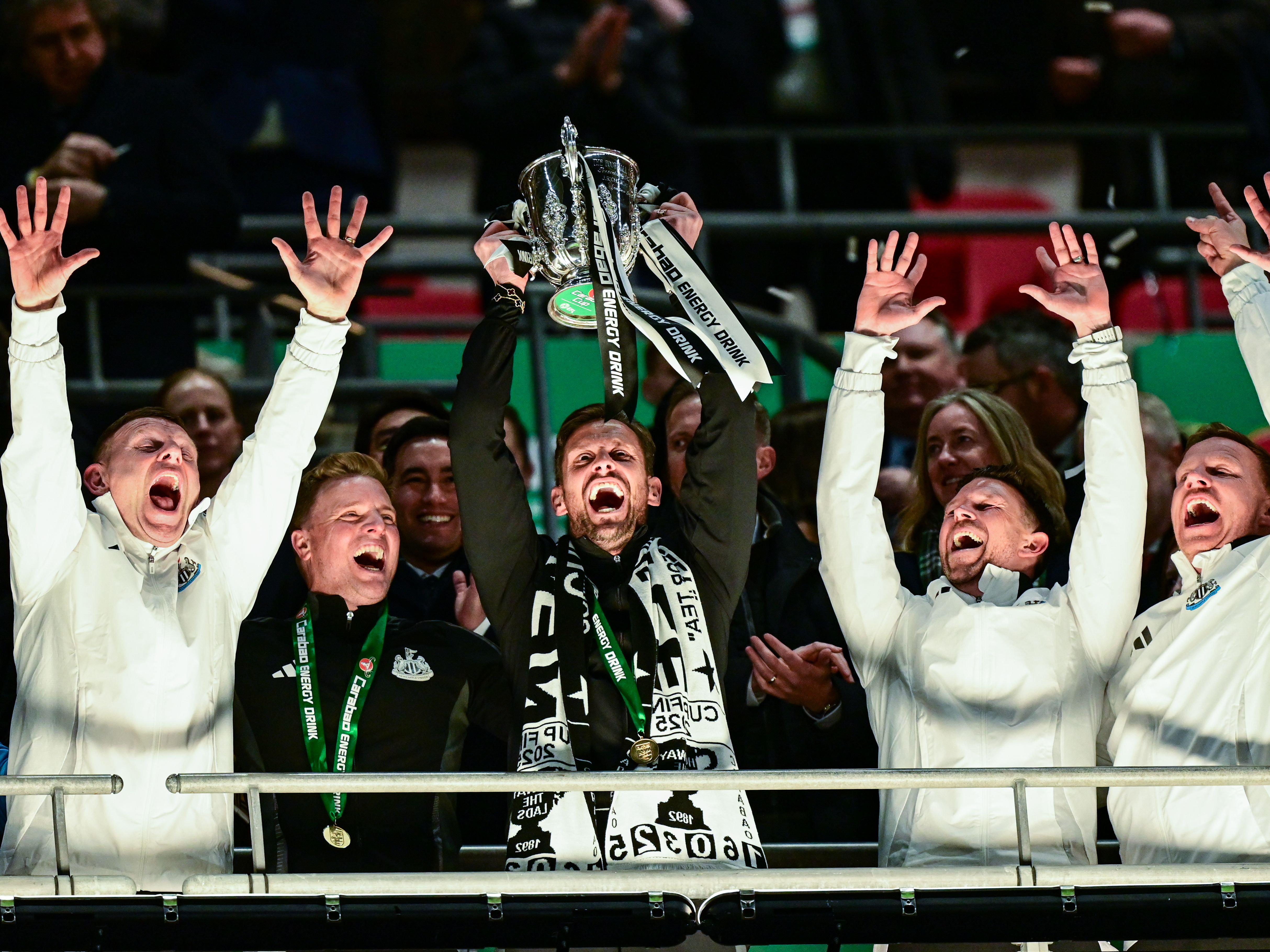 Coaching staff trophy lift image