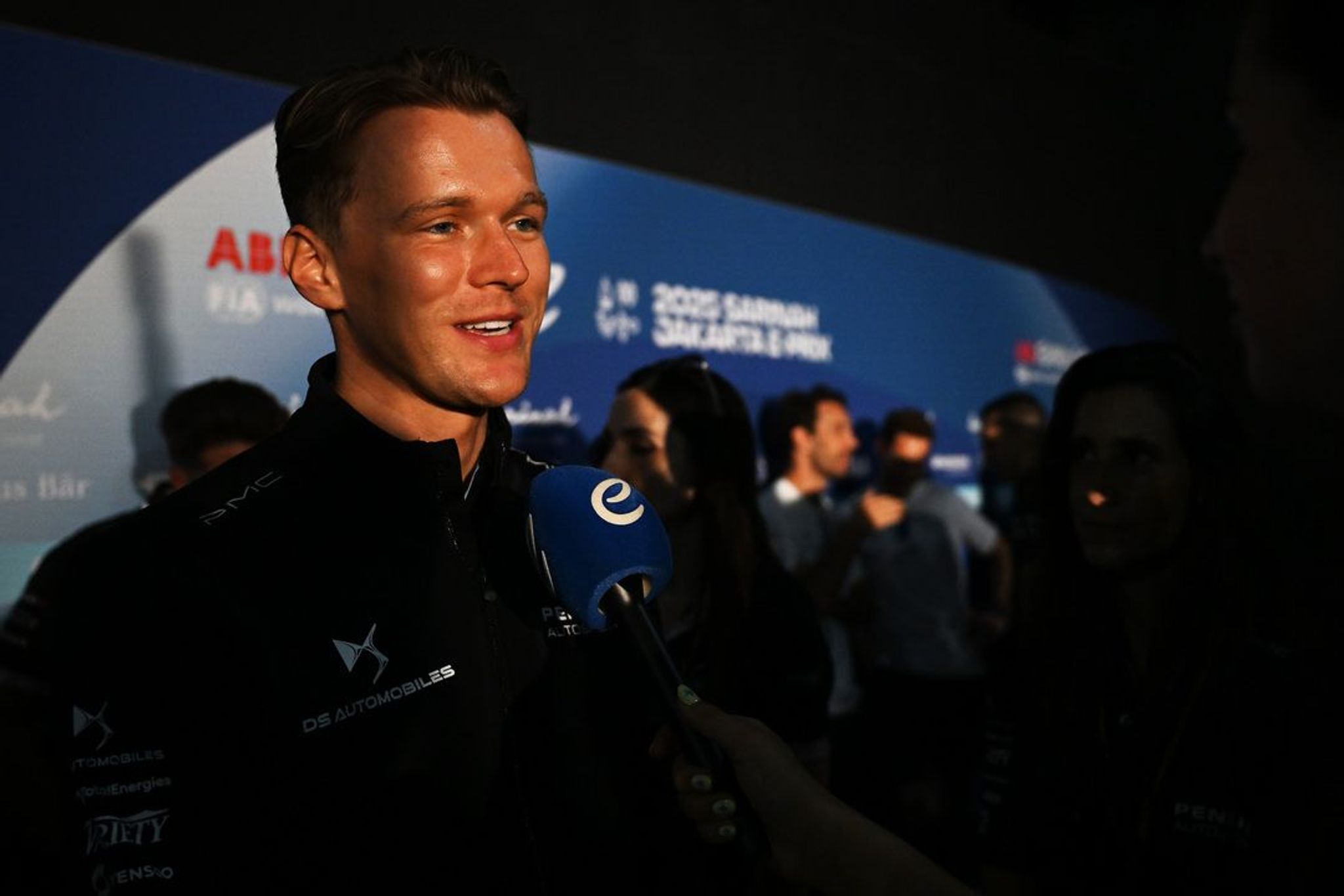 MEDIA PEN: The drivers chat ahead of Jakarta