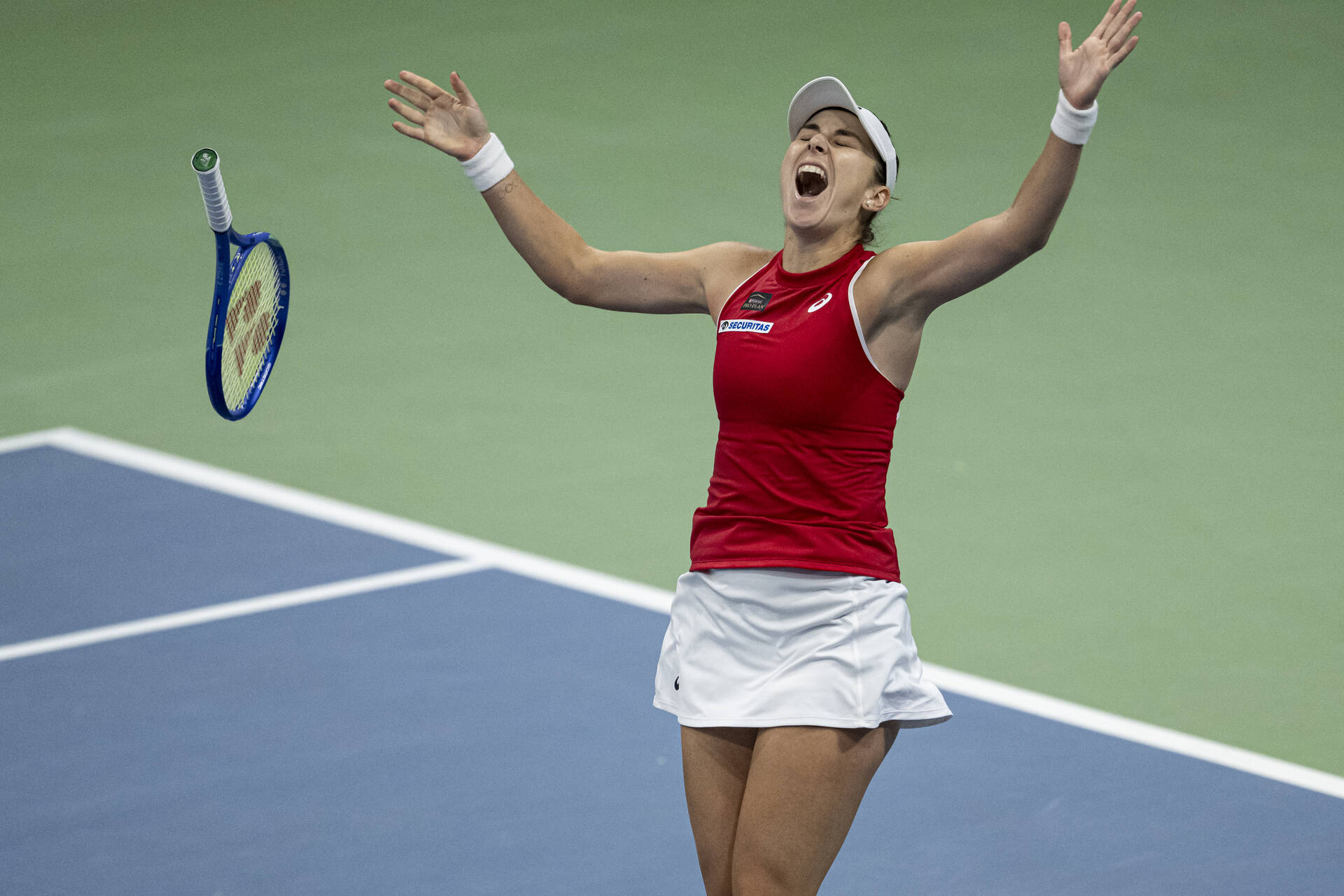Belinda Bencic celebrates victory over Marie Bouzkova