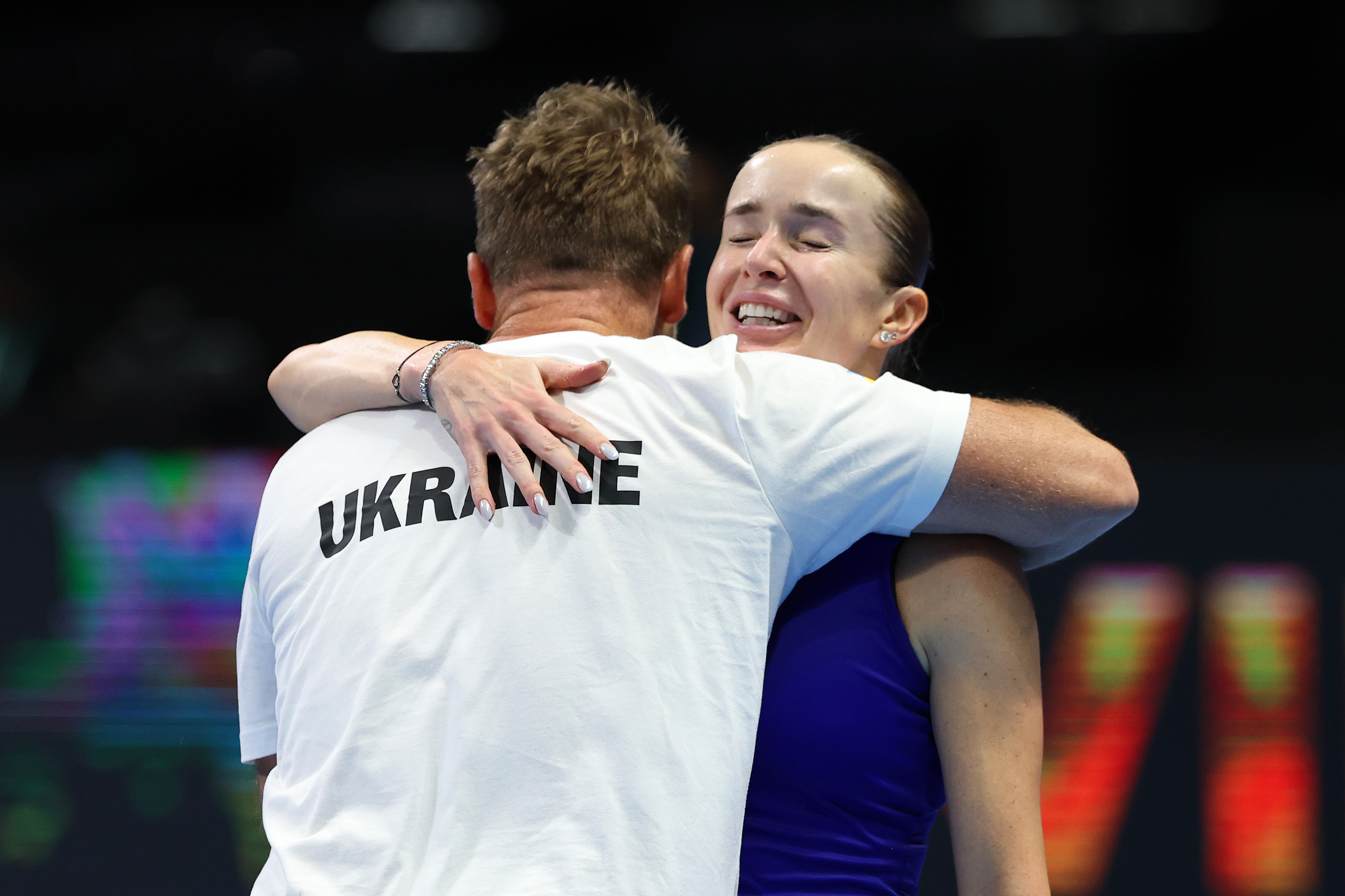 Elina Svitolina embraced by Illya Marchenko