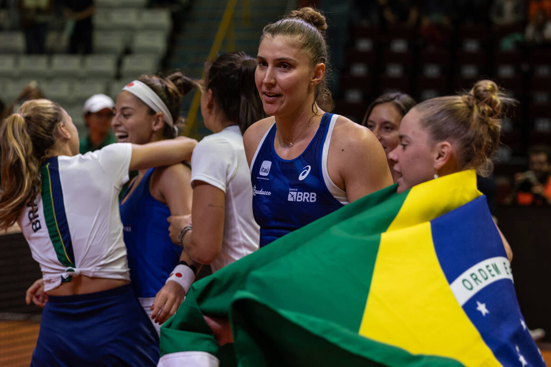 Beatriz Haddad Maia celebrates with Laura Pigossi after Brazil's win