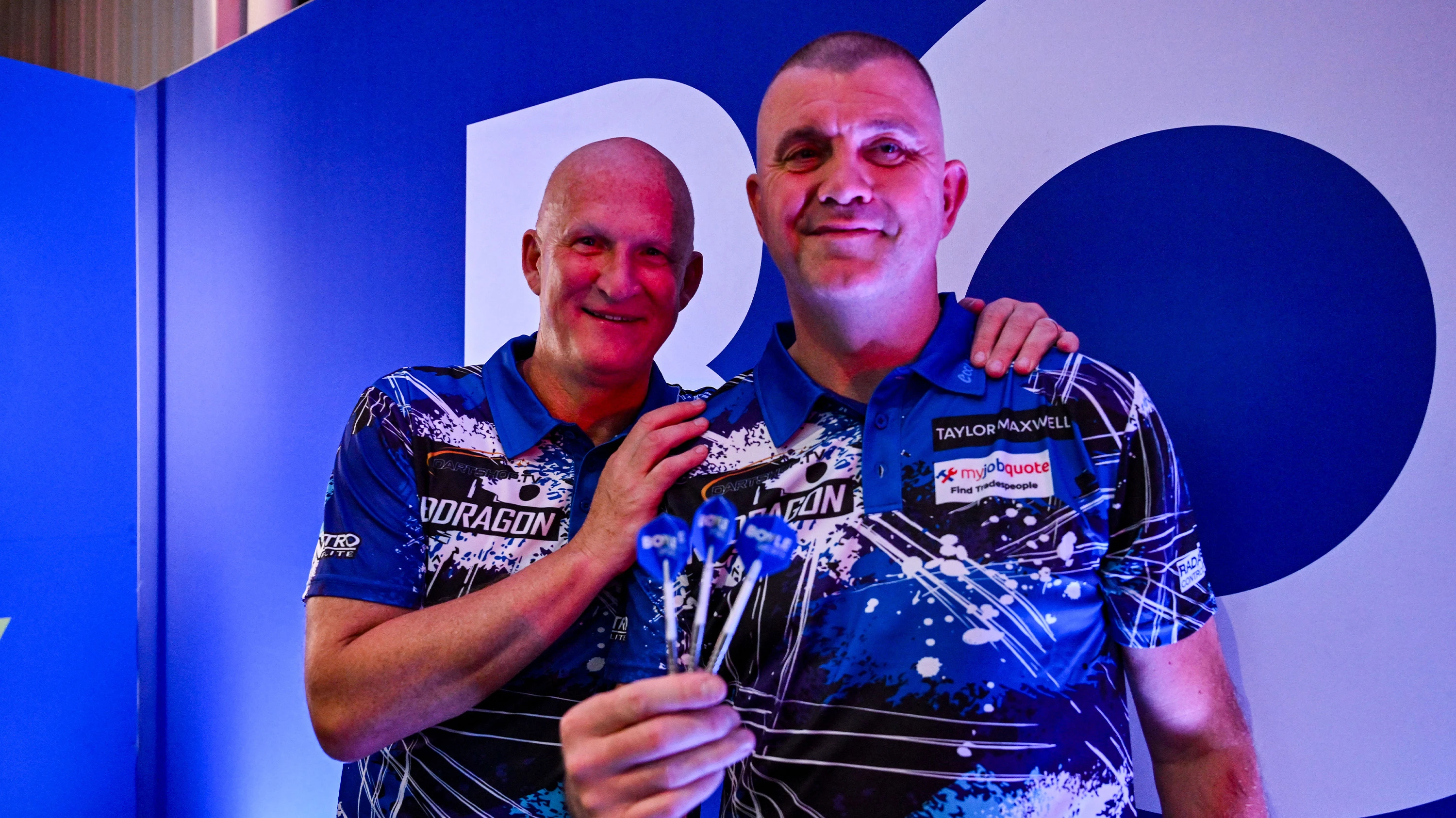 Simon Grayson Dominic Matteo Oct 26 Hugging holding darts