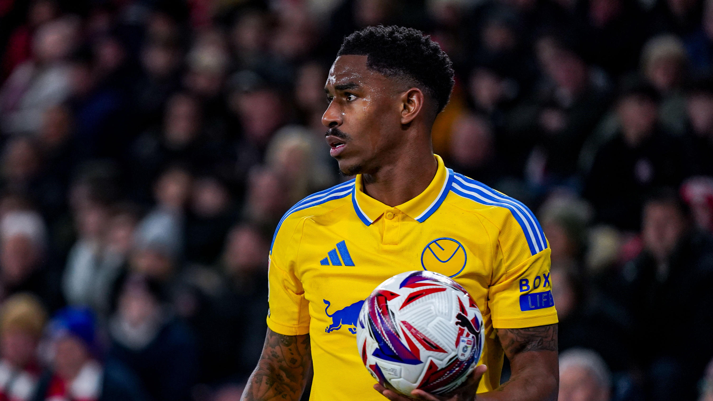 Junior Firpo Holding A Football