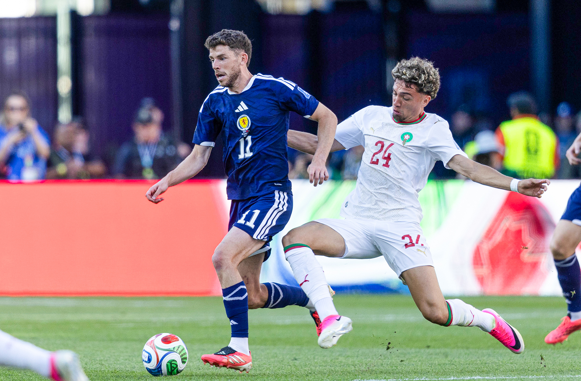  Scotland's Ryan Christie and Morocco's Neil El Aynaoui in action