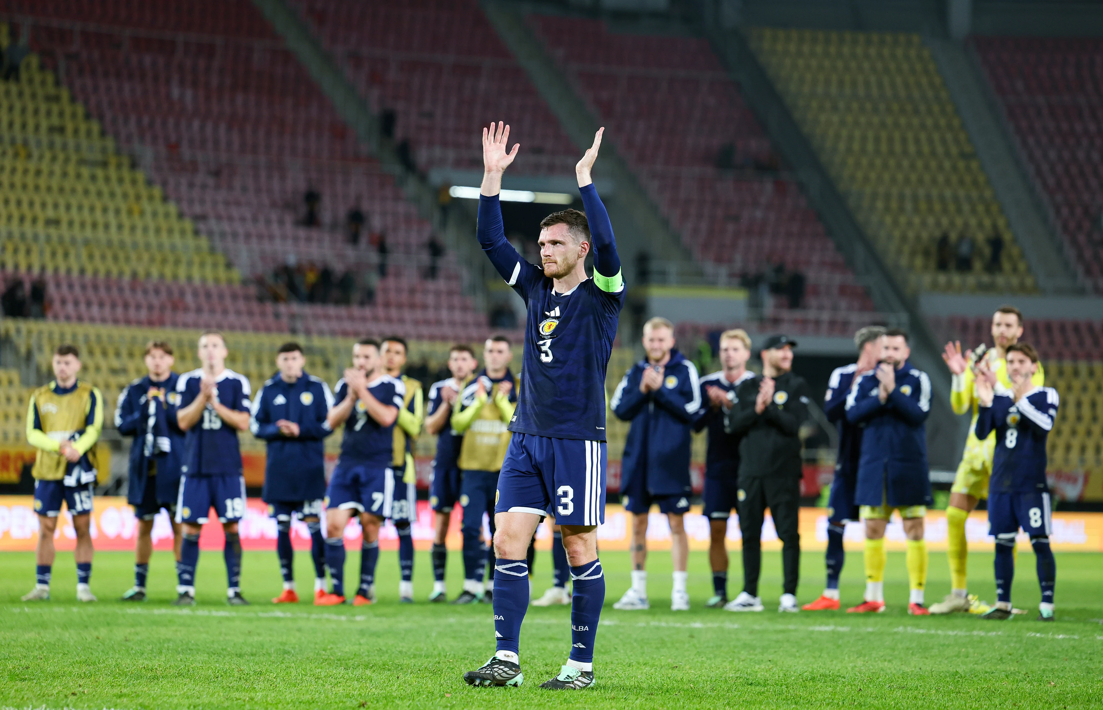 Andy Robertson takes the applause from the supporters at full time