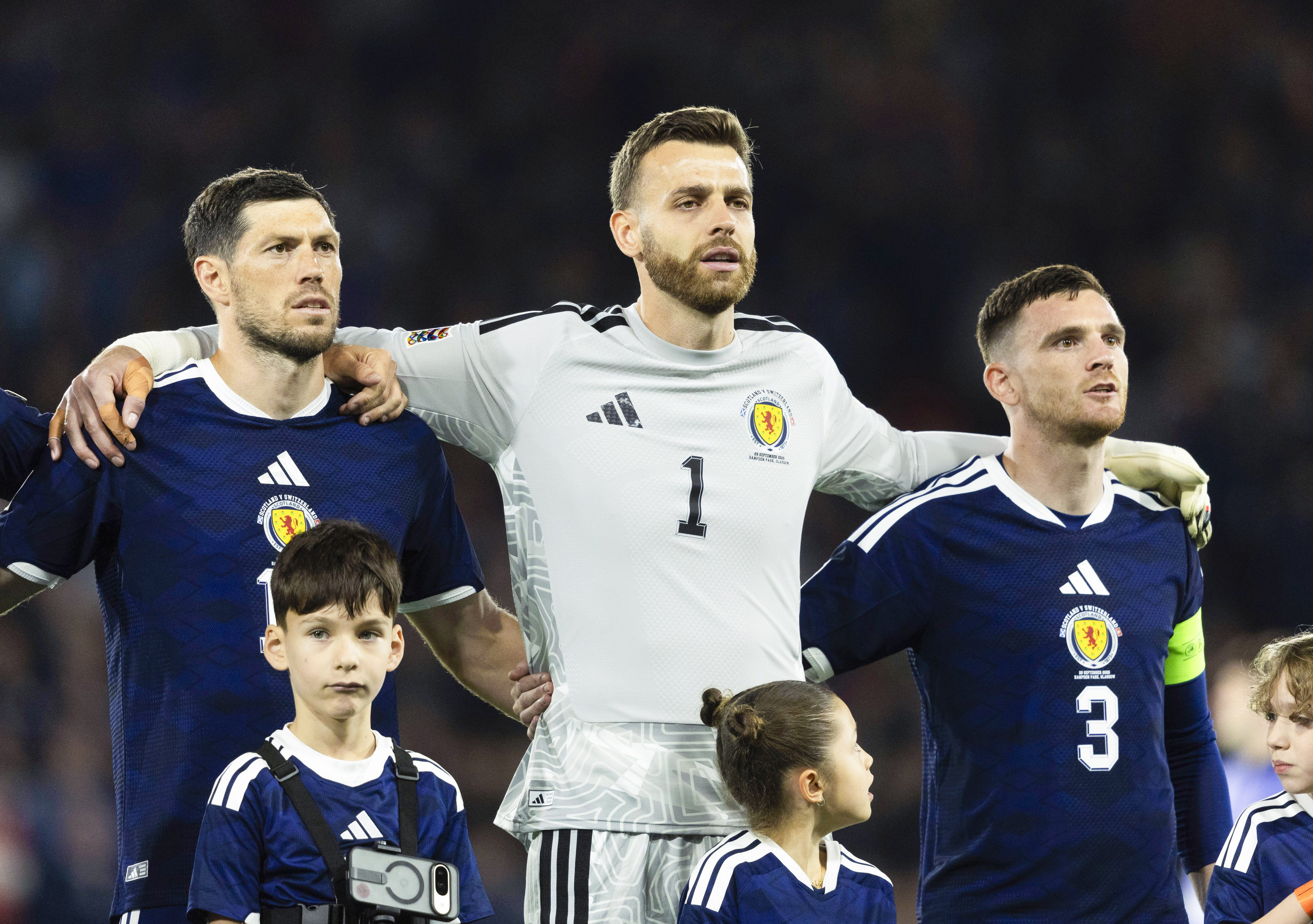 Scotland's Scott McKenna, Angus Gunn and Andy Robertson (L-R)