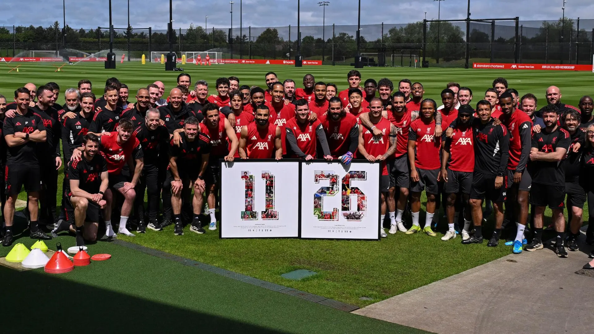 Reds squad present framed mementos to Andy Robertson and Mo Salah