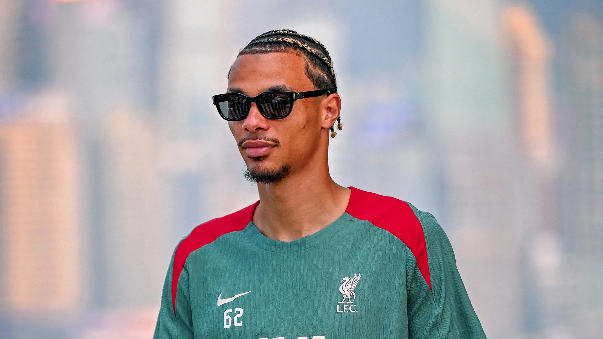Photos: Hugo Ekitike checks in with the Reds in Hong Kong