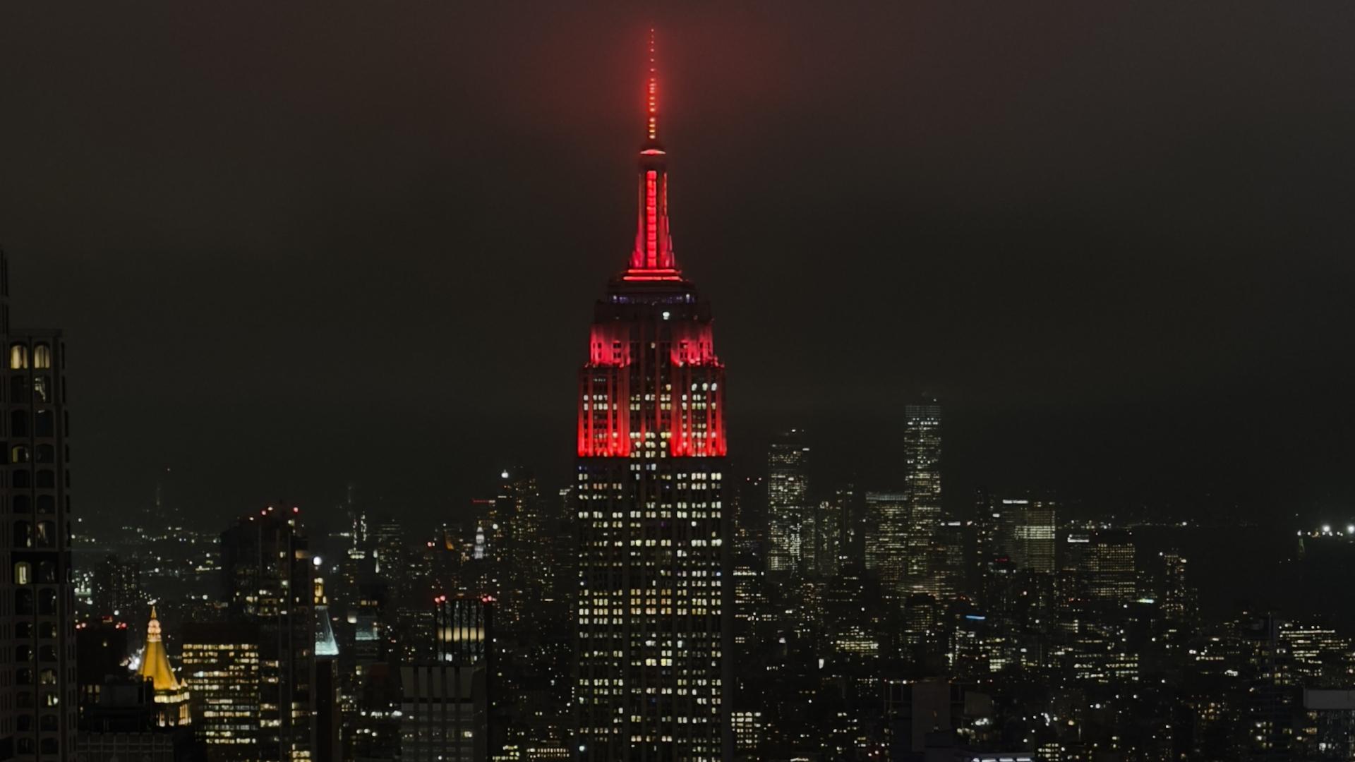 Iconic Empire State Building in New York lit up in Liverpool colours
