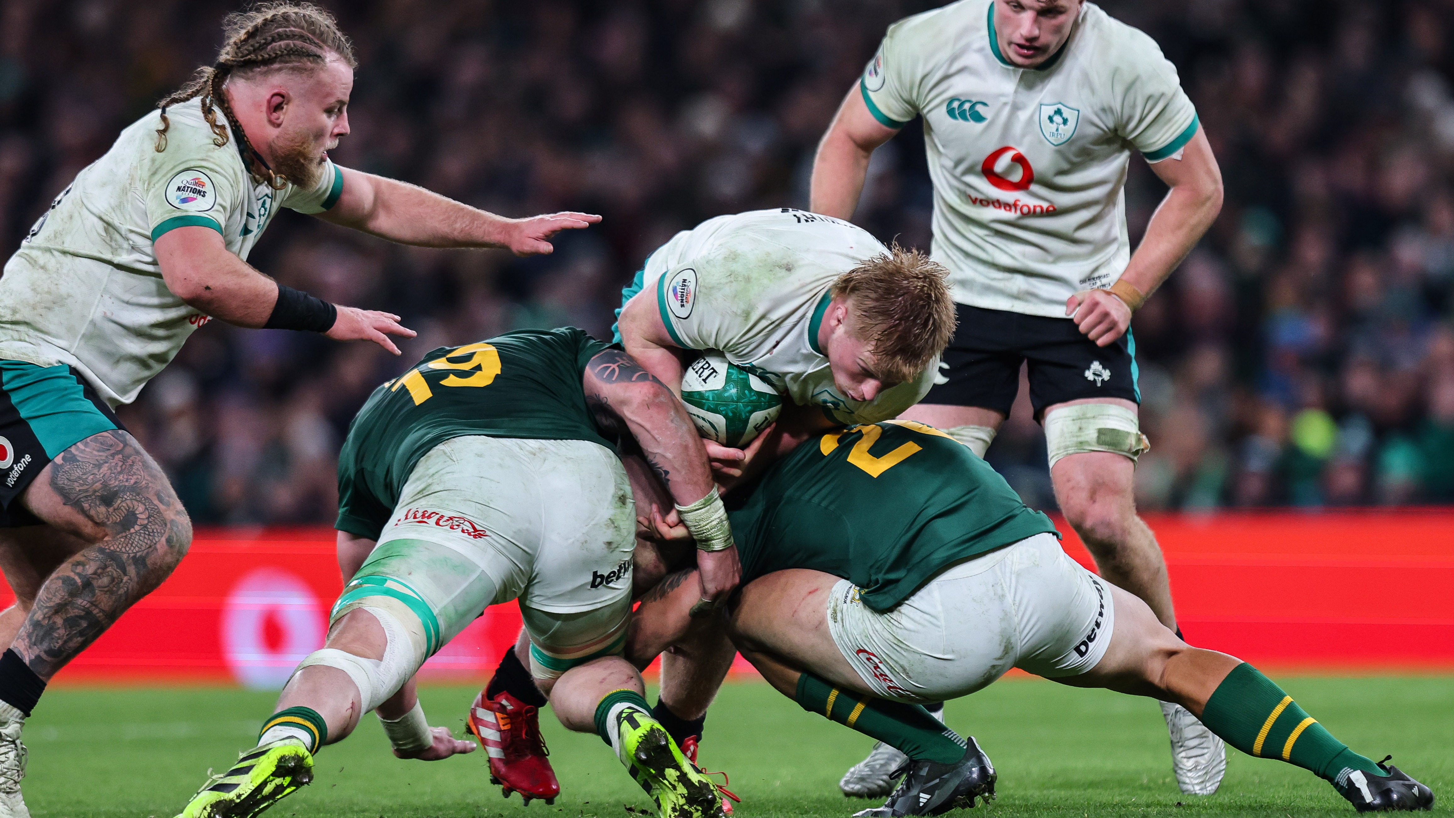 Ireland's Paddy McCarthy is tackled by South Africa’s RG Snyman and Kwagga Smith during the 2025 Quilter Nations Series game between Ireland and South Africa in Aviva Stadium, Dublin.