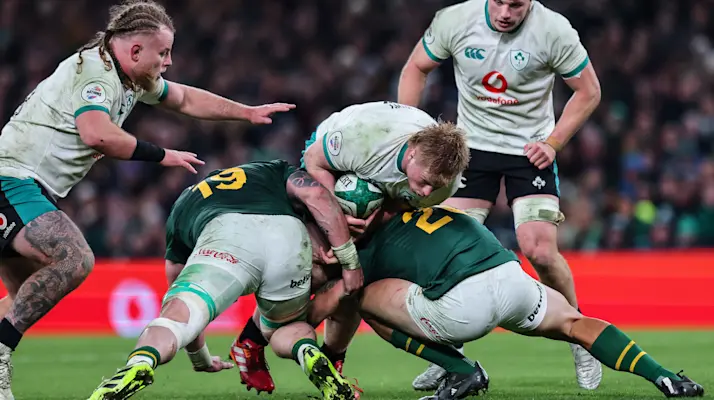Ireland's Paddy McCarthy is tackled by South Africa’s RG Snyman and Kwagga Smith during the 2025 Quilter Nations Series game between Ireland and South Africa in Aviva Stadium, Dublin.