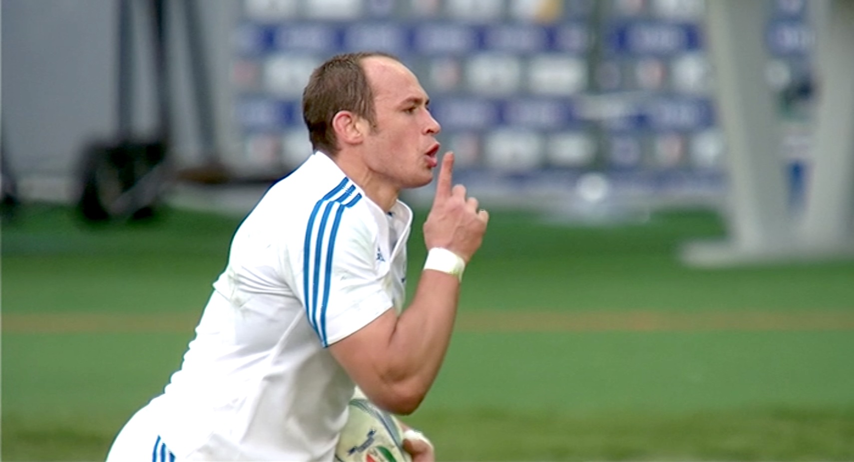 Sergio Parisse puts his finger to his mouth in a hushing motion as he celebrates scoring against France in 2013.