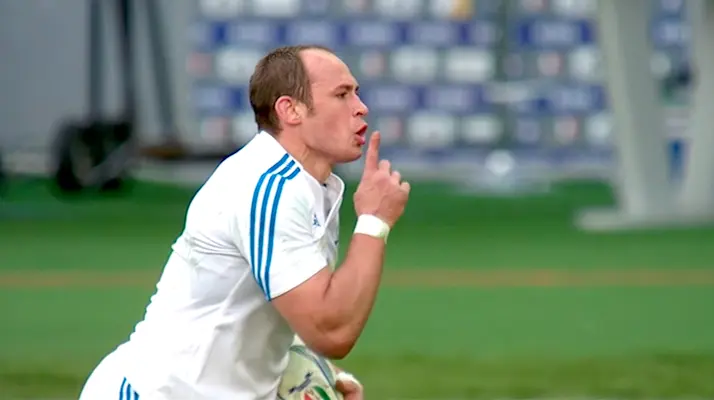 Sergio Parisse puts his finger to his mouth in a hushing motion as he celebrates scoring against France in 2013.