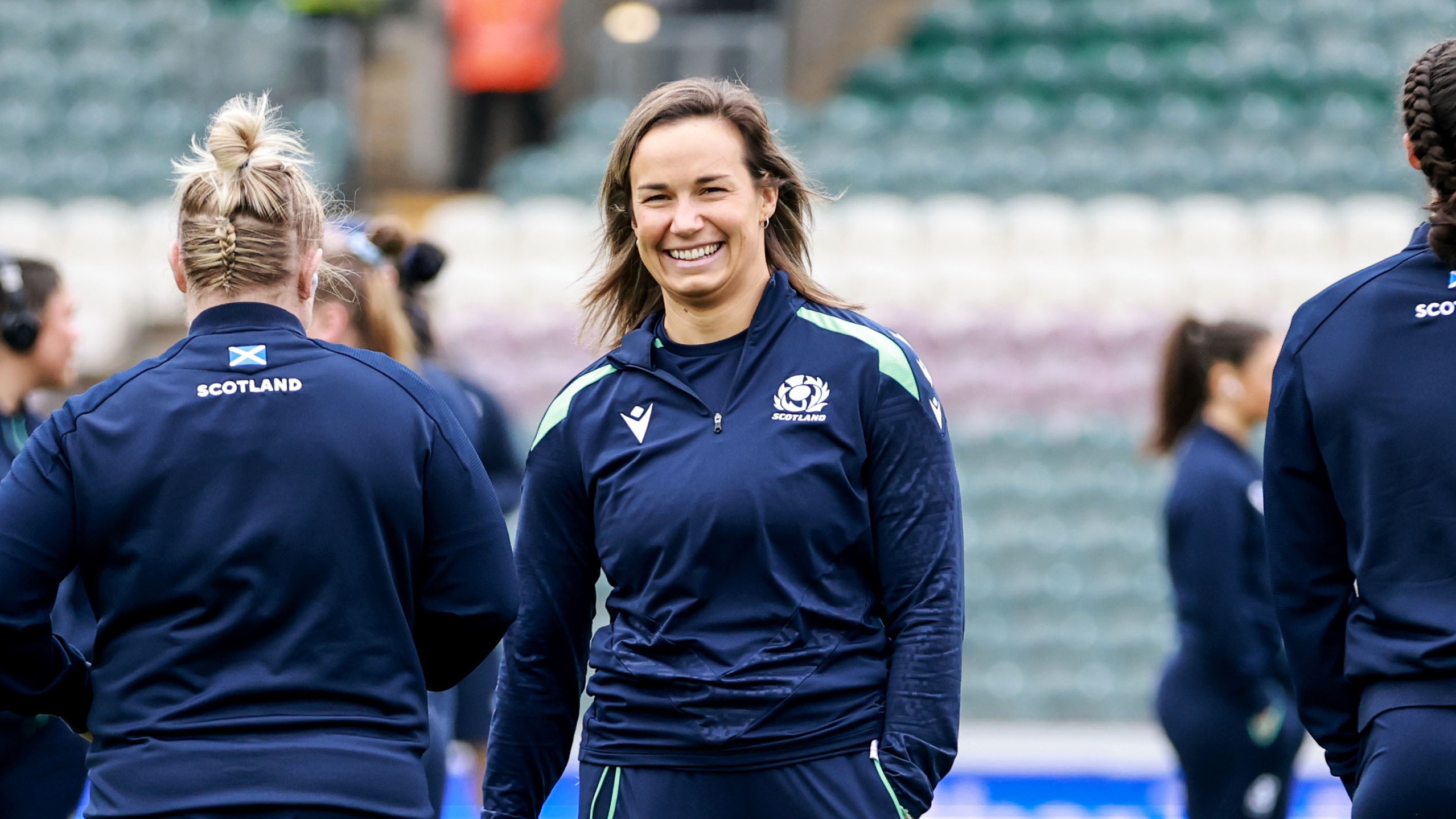 Rachel Malcolm smiles at a teammate ahead of the 2025 Guinness Women's Six Nations Championship Round 4 game between England and Scotland in Leicester.