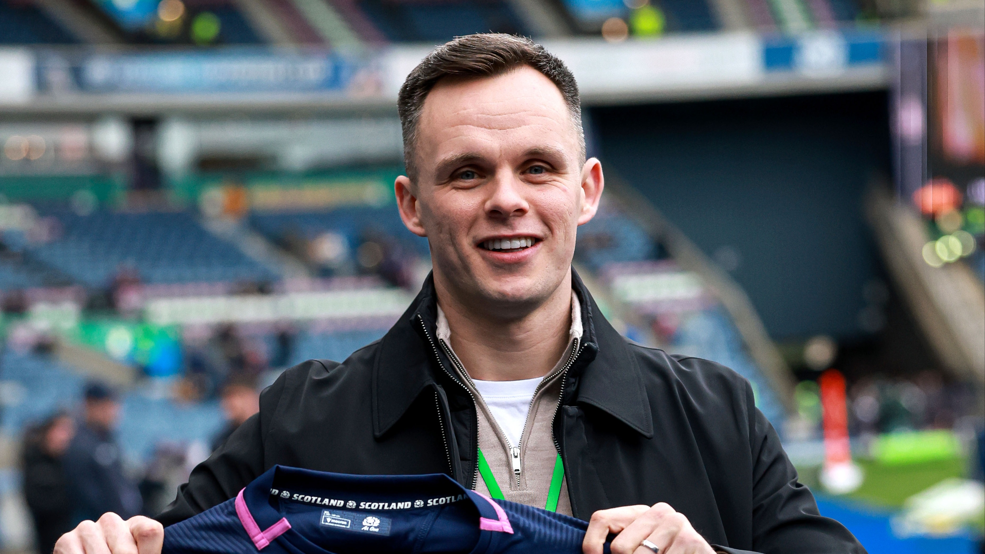Hearts captain Lawrence Shankland poses with a Scottish rugby jersey at Murrayfield ahead of the 2026 Calcutta Cup match.