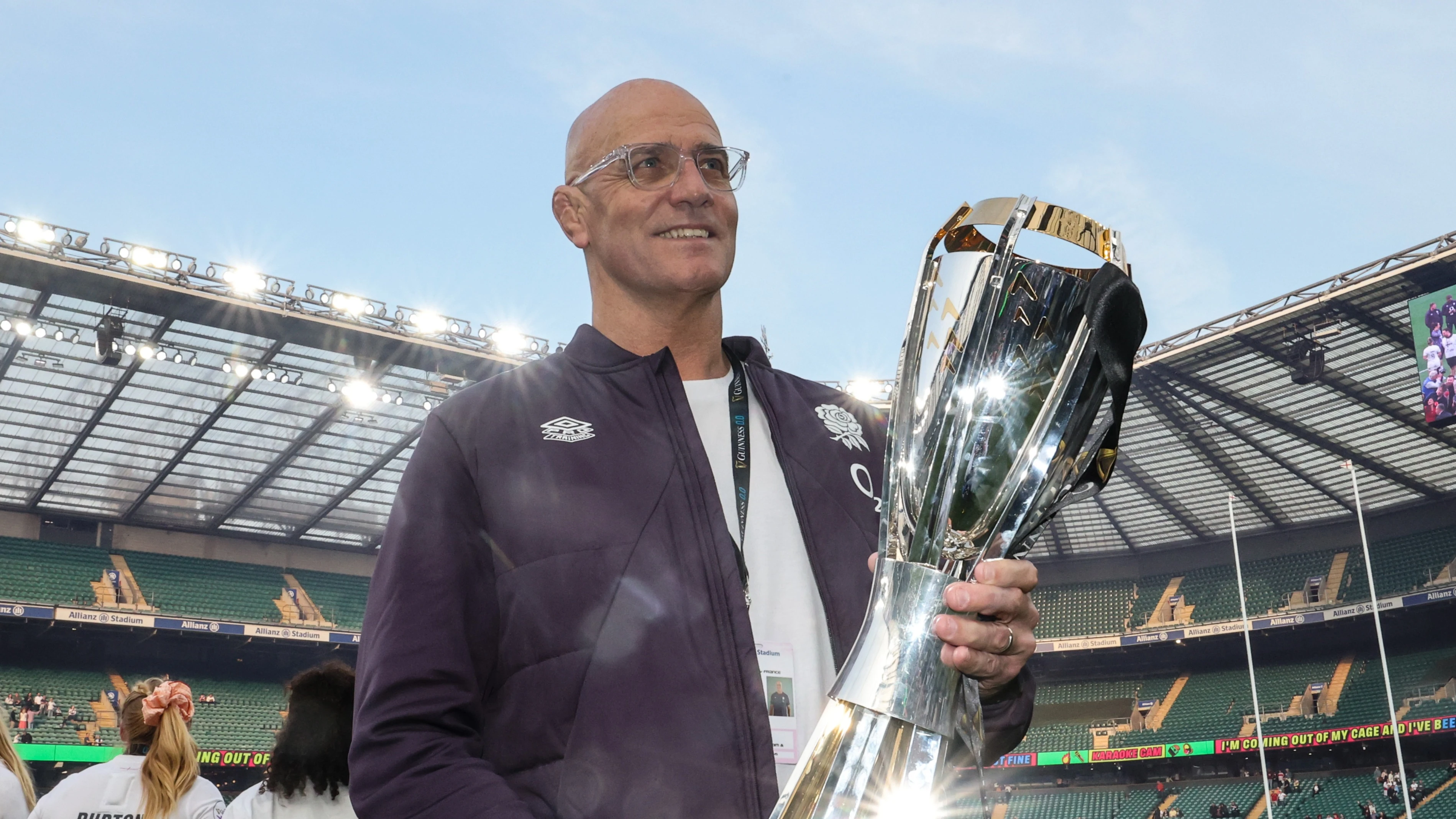 England head coach John Mitchell celebrates with the trophy following the 2025 Guinness Women's Six Nations Championship victory against France.
