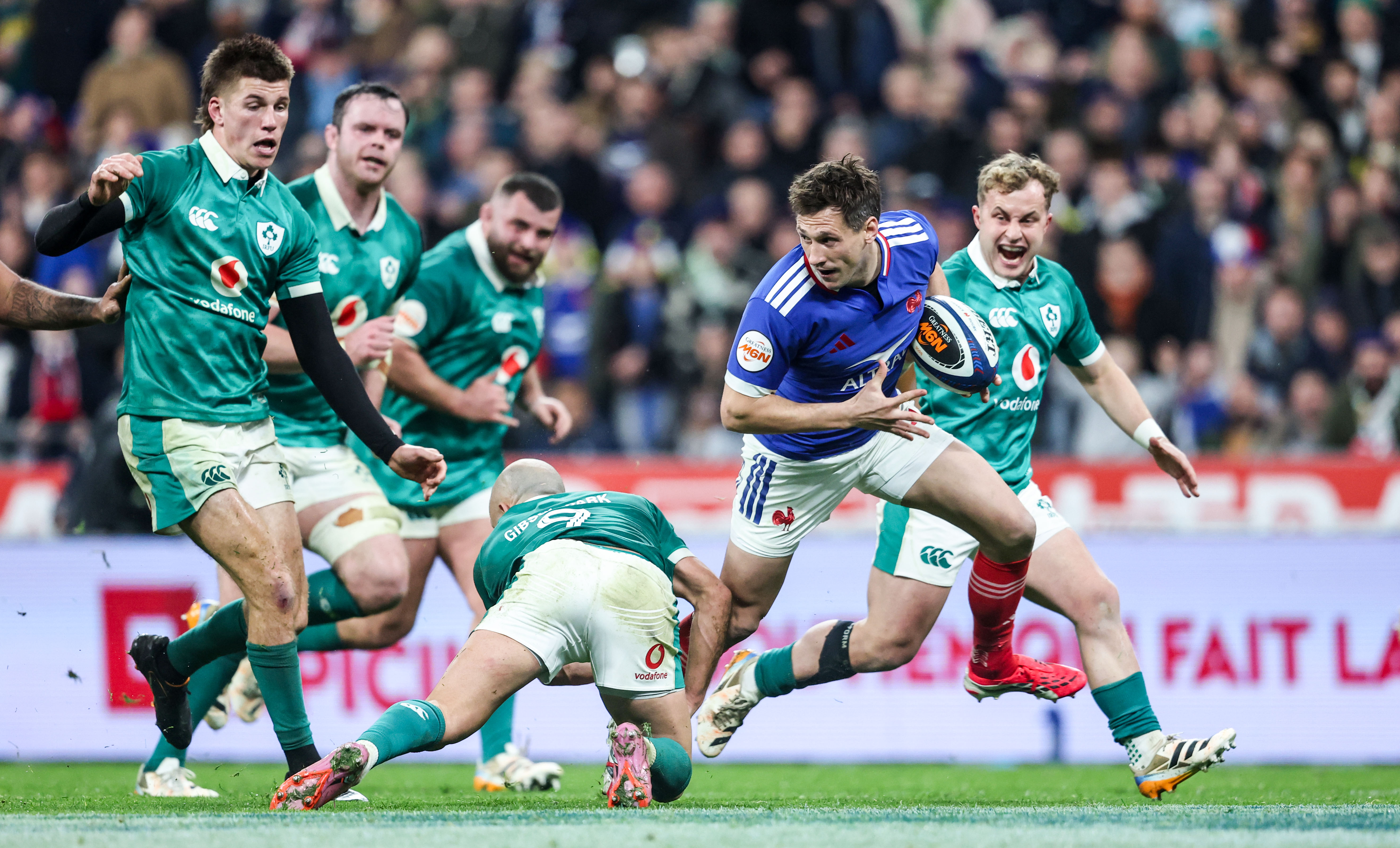 France's Baptiste Serin evades the Irish defence during the 2026 Guinness Men's Six Nations opener in Paris.