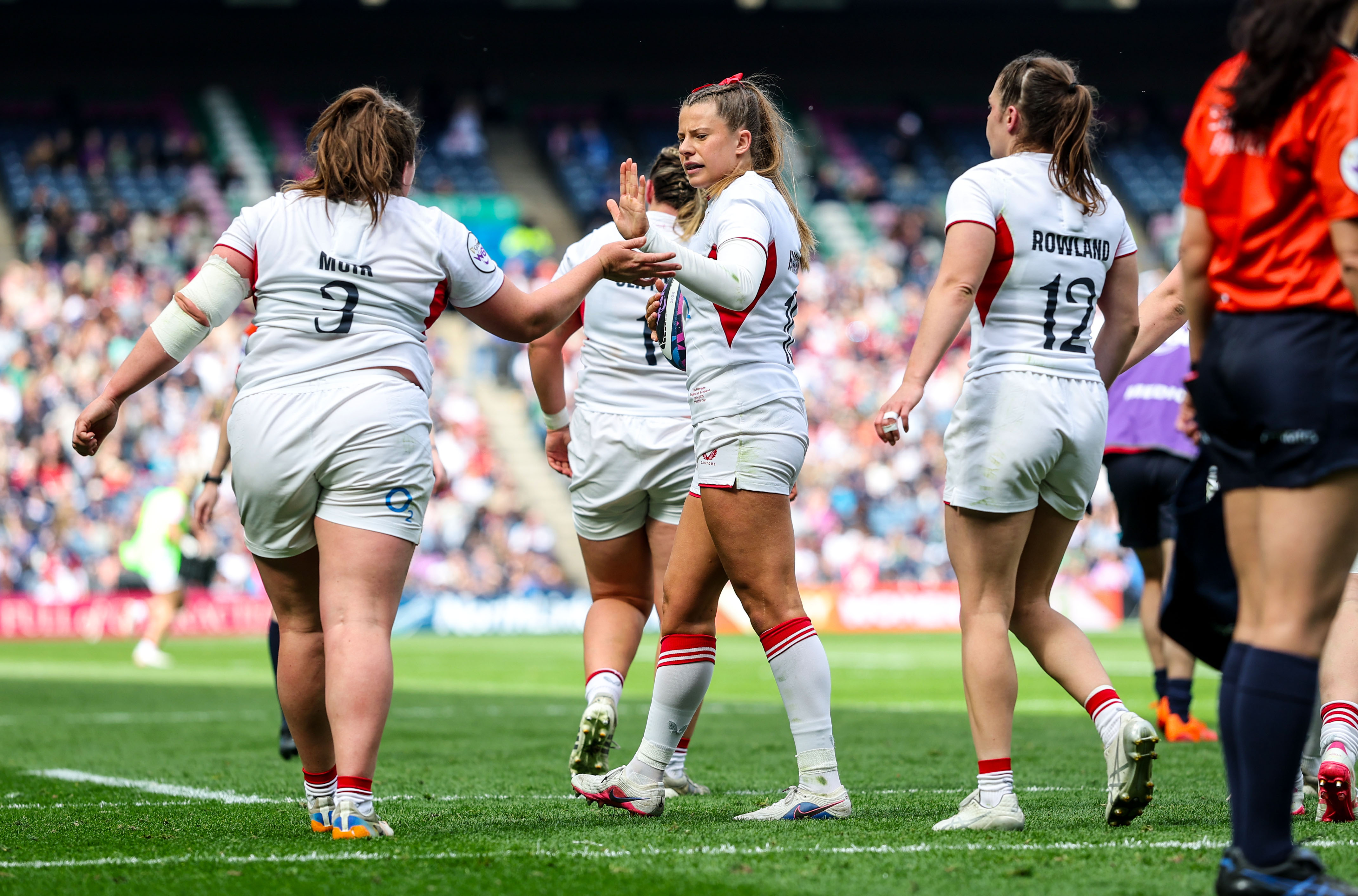 England's Zoe Harrison and Maud Muir celebrate a try 