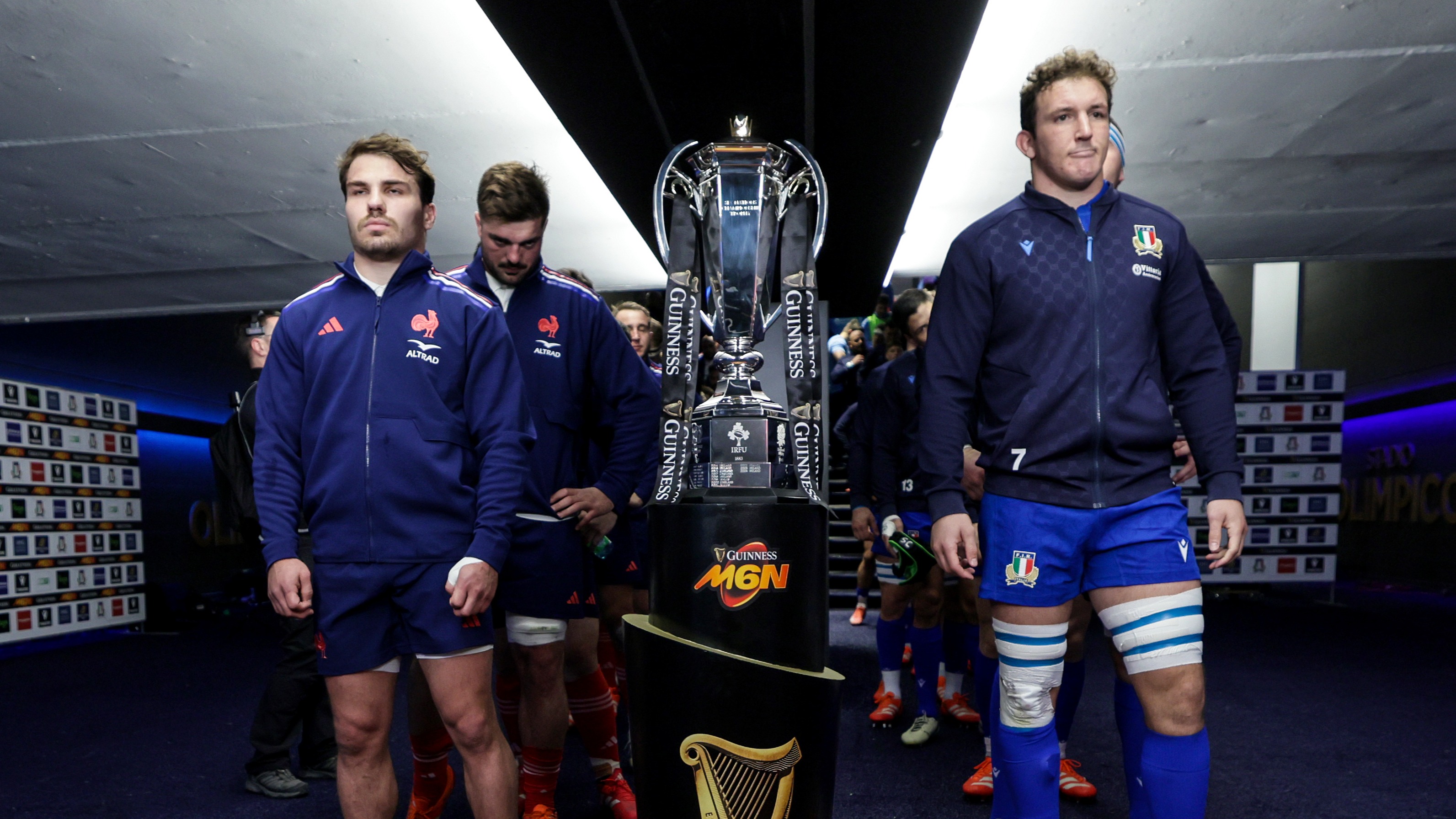 Captains Antoine Dupont and Michele Lamaro line up either side of the Championship trophy before the 2025 match in Rome.