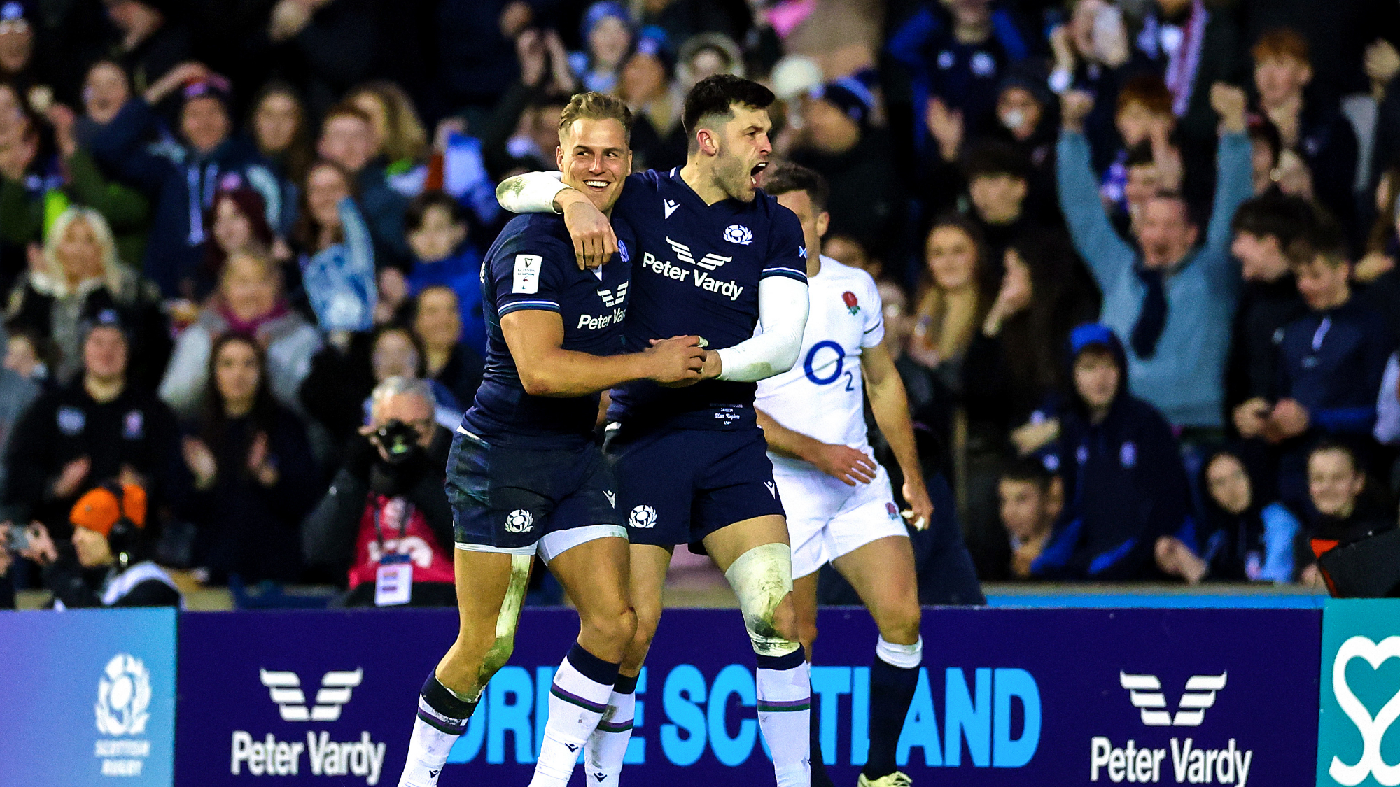 Duhan van der Merwe celebrates his hat-trick with Blair Kinghorn