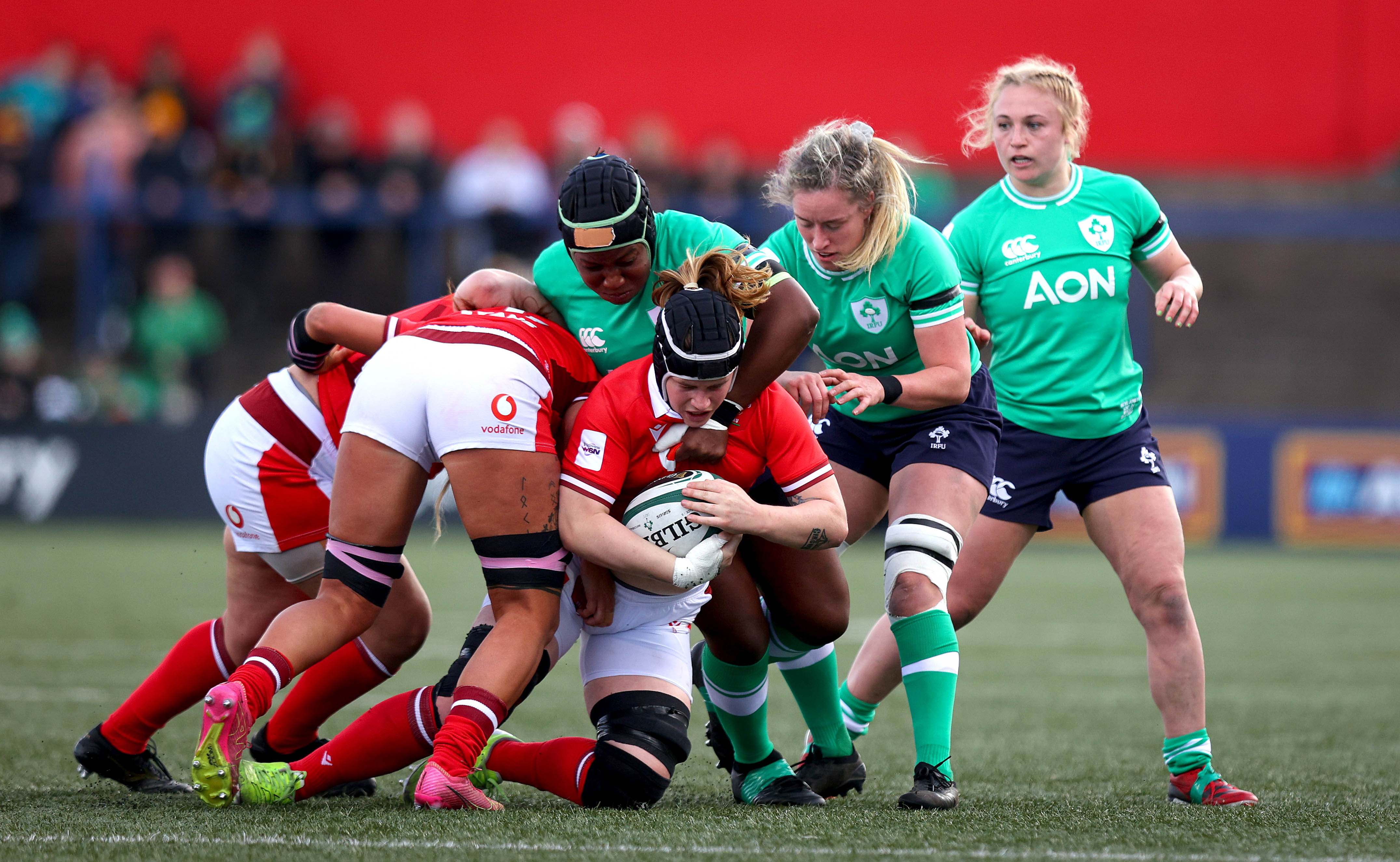 Ireland gets to grips with Wales' Bethan Lewis during the 2024 Guinness Women's Six Nations Championship Round 3 meeting in Musgrave Park, Cork