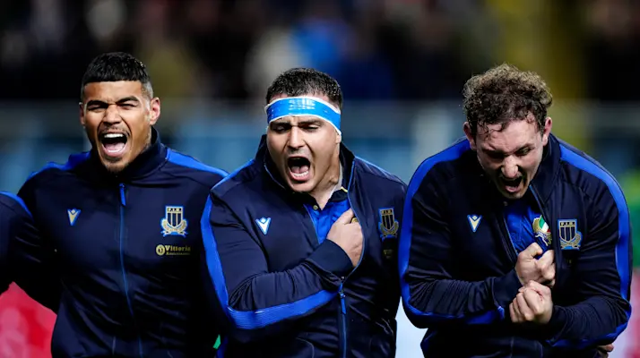 Monty Ioane, Danilo Fischetti and Michele Lamaro reach the climax of the Italian national anthem during the Quilter Nations Series.