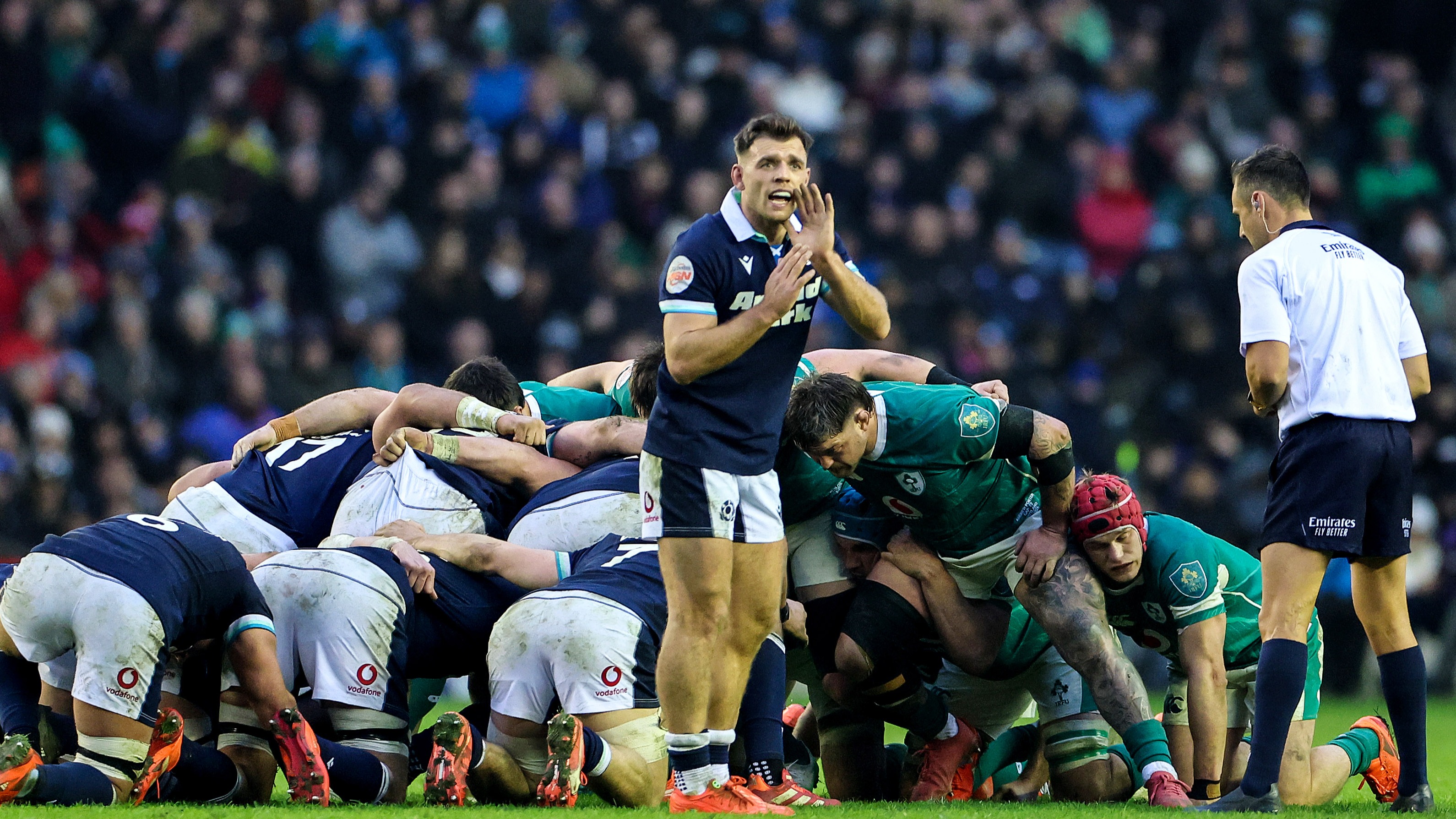 Scotland's Ben White speaks to his fly-half before a scrum against Ireland in the 2025 Championship.