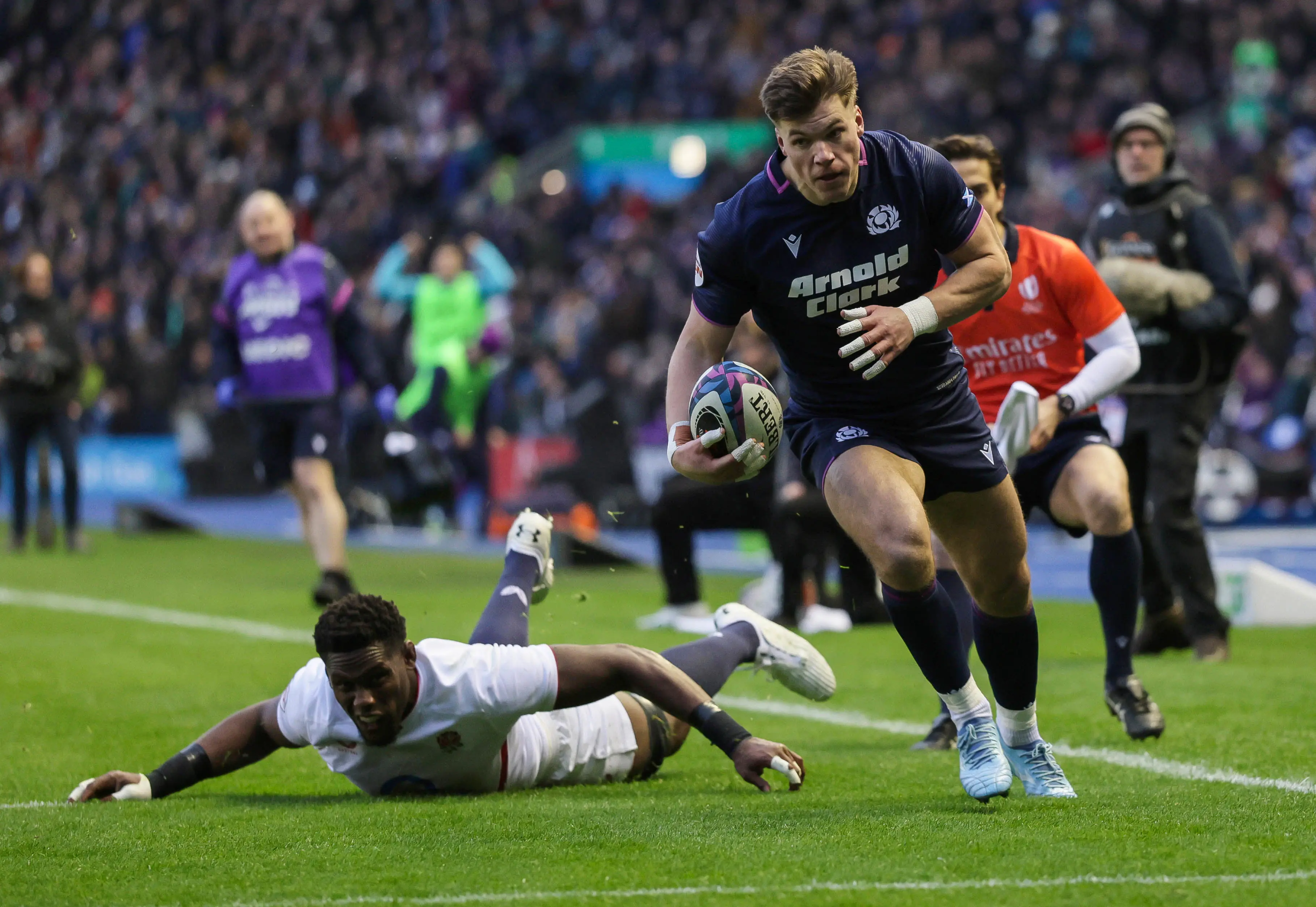 Huw Jones runs over for a try against England in the 2026 Calcutta Cup match at Murrayfield.