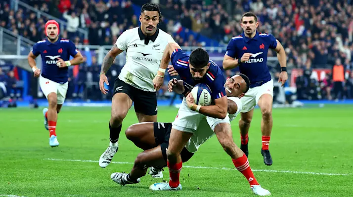 France's Romain Buros makes his way to score a try despite New Zealand's Sevu Reece during the Autumn Nations Series between France and New Zealand at Stade de France