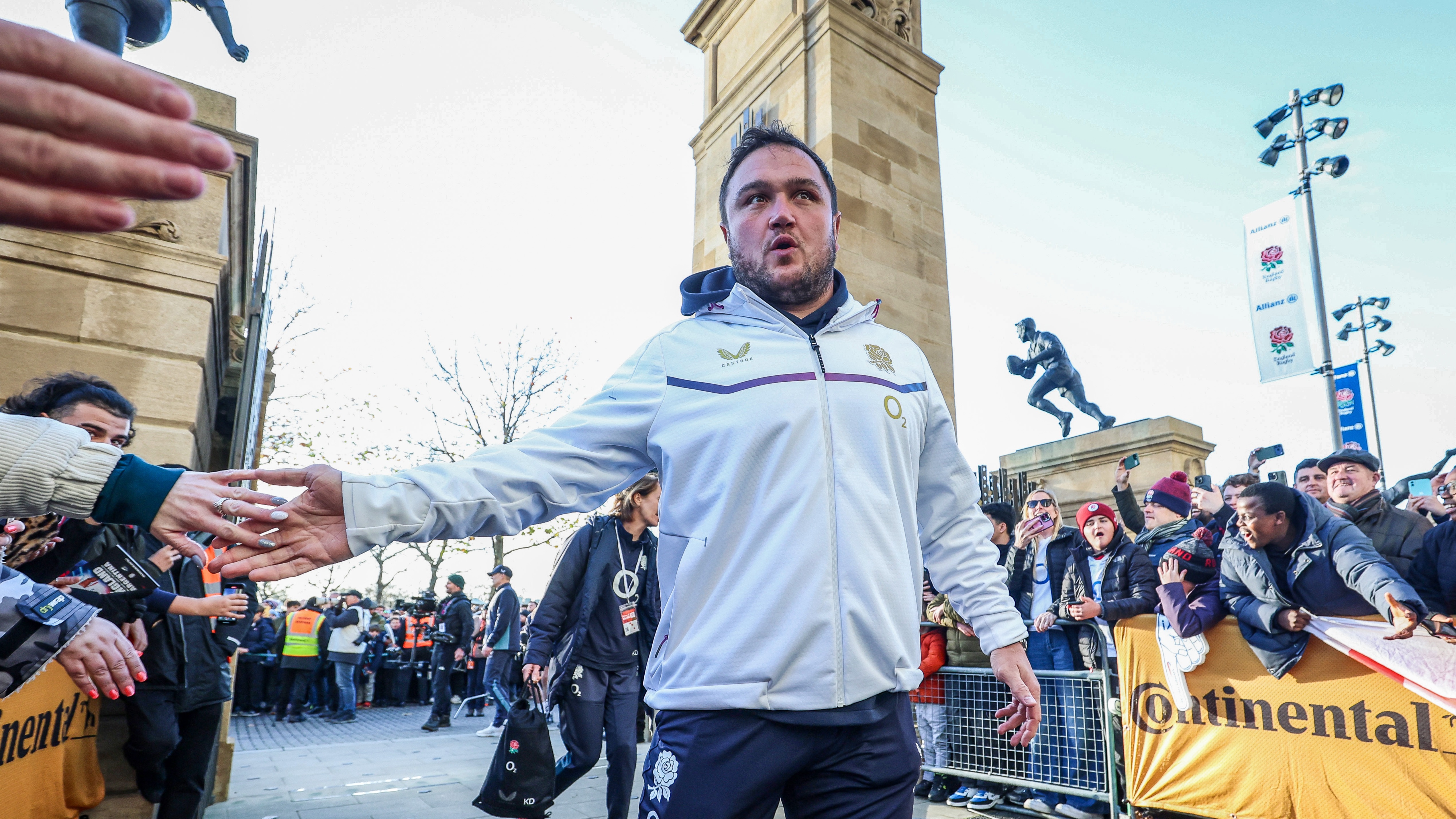 Jamie George greets a fan with a high five as he arrives at Allianz Stadium during autumn 2025.
