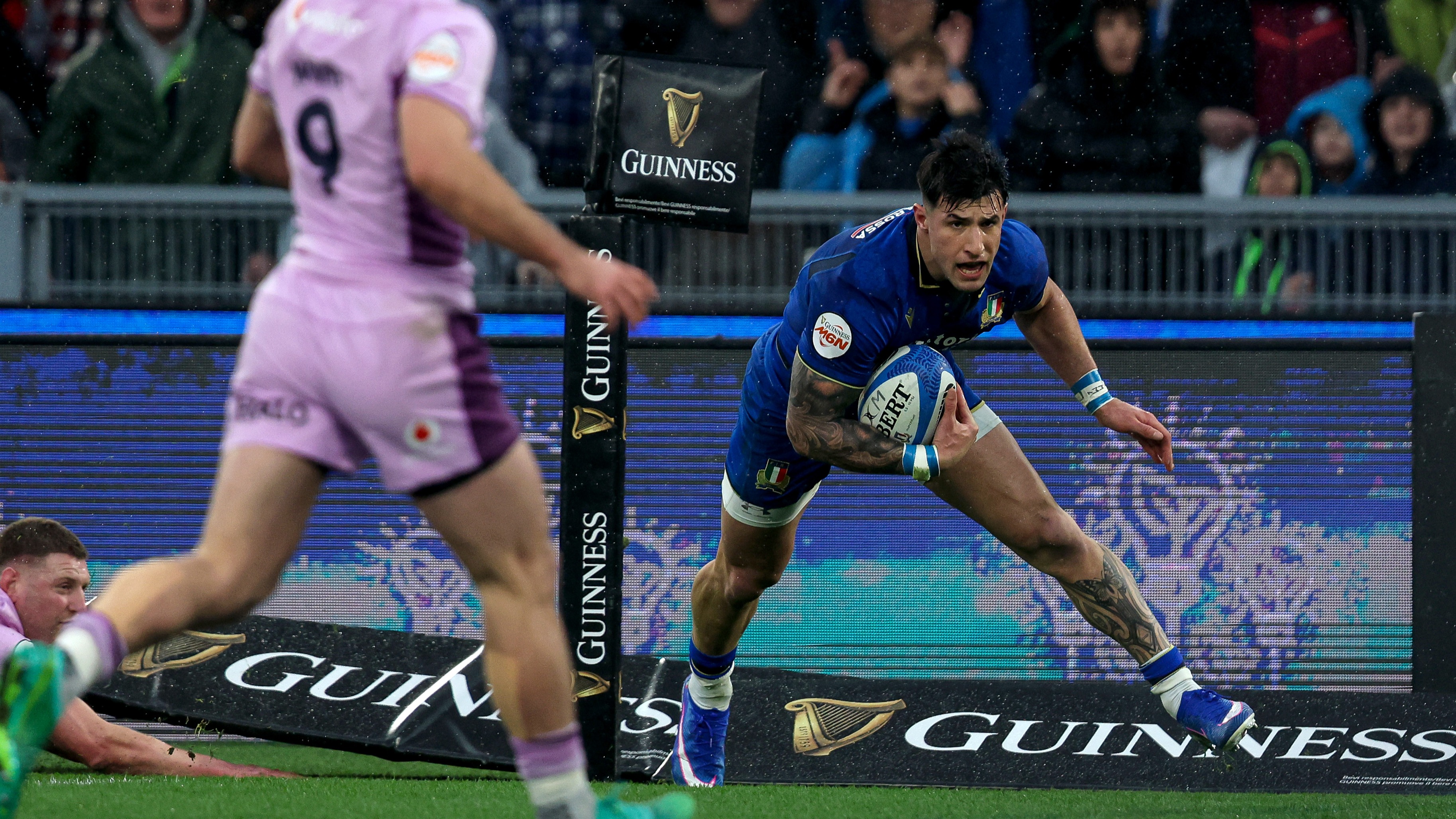 Tommaso Menoncello dives in for a try against Scotland in the round one match of the 2026 Championship in Rome.