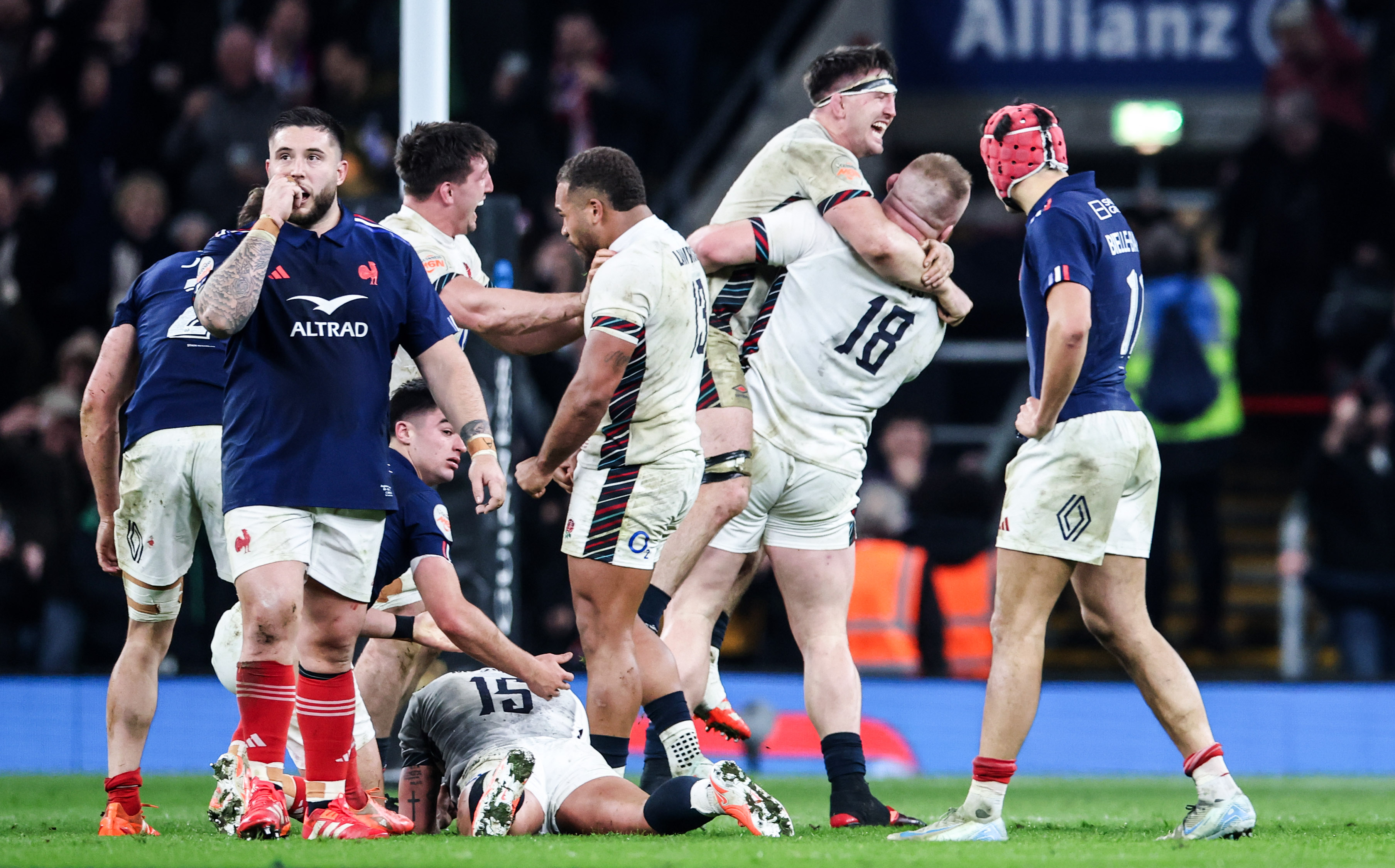 France's Cyril Baille looks dejected as England's Joe Heyes and Ben Curry celebrate their 2025 Guinness Six Nations Championship victory in London.