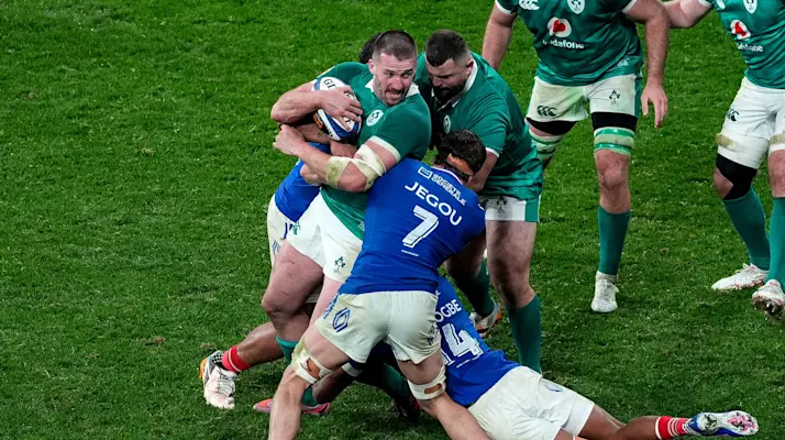 Ireland's Stuart McCloskey is tackled by France’s Oscar Jegou during the 2026 Guinness Six Nations Championship Round 1 game between France and Ireland in Stade de France, Paris