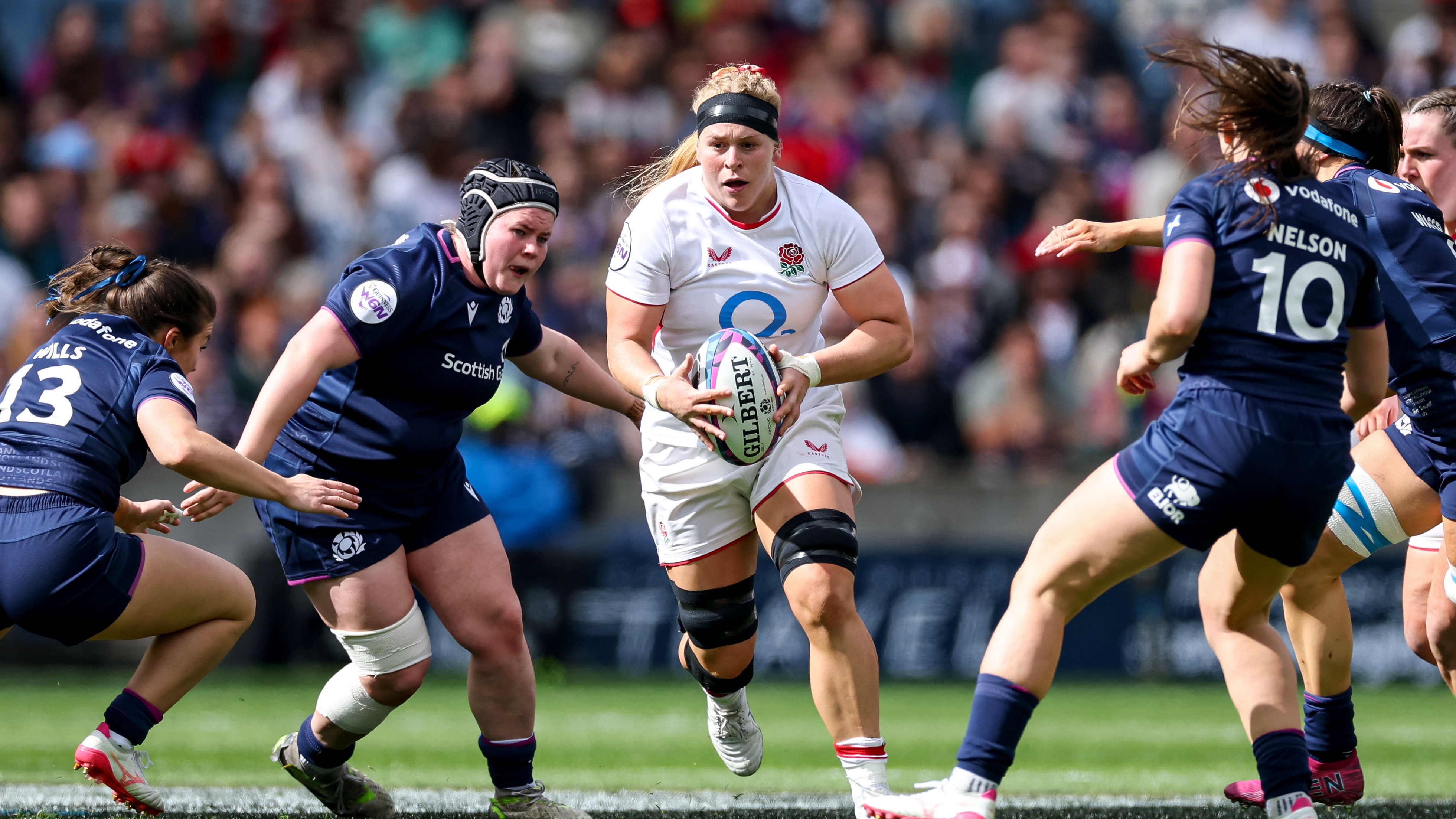 England's Abi Burton comes up against Evie Wills, Leah Bartlett and Helen Nelson of Scotland during the 2026 Guinness Women's Six Nations Championship Round 2 game between Scotland and England