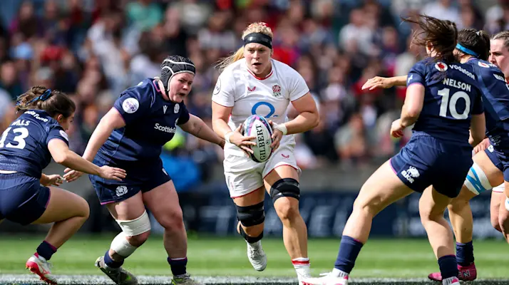 England's Abi Burton comes up against Evie Wills, Leah Bartlett and Helen Nelson of Scotland during the 2026 Guinness Women's Six Nations Championship Round 2 game between Scotland and England