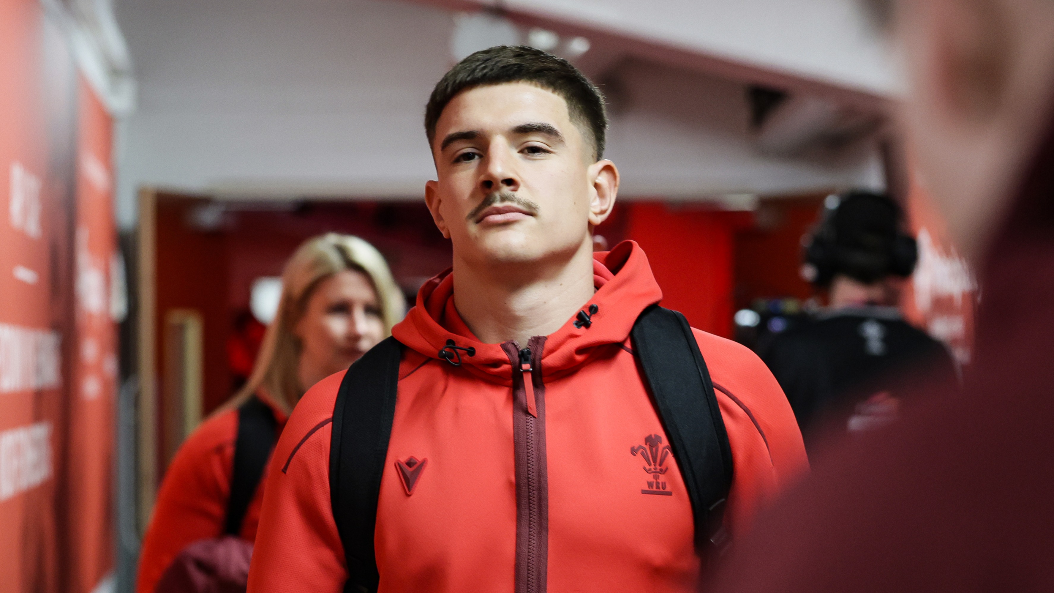 Joe Hawkins walks towards the Wales team room at Principality Stadium.