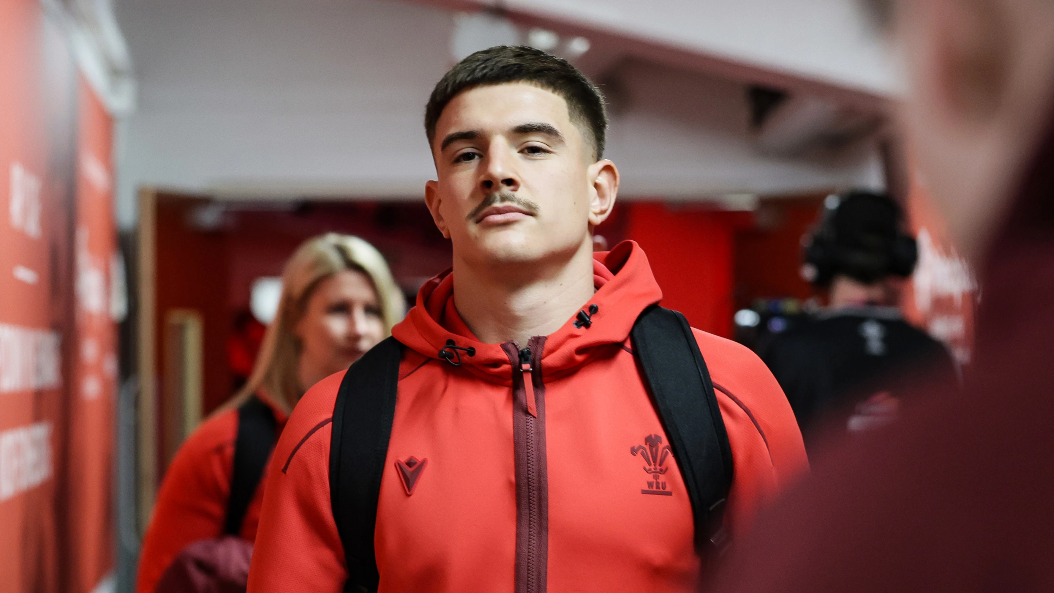 Joe Hawkins walks towards the Wales team room at Principality Stadium.