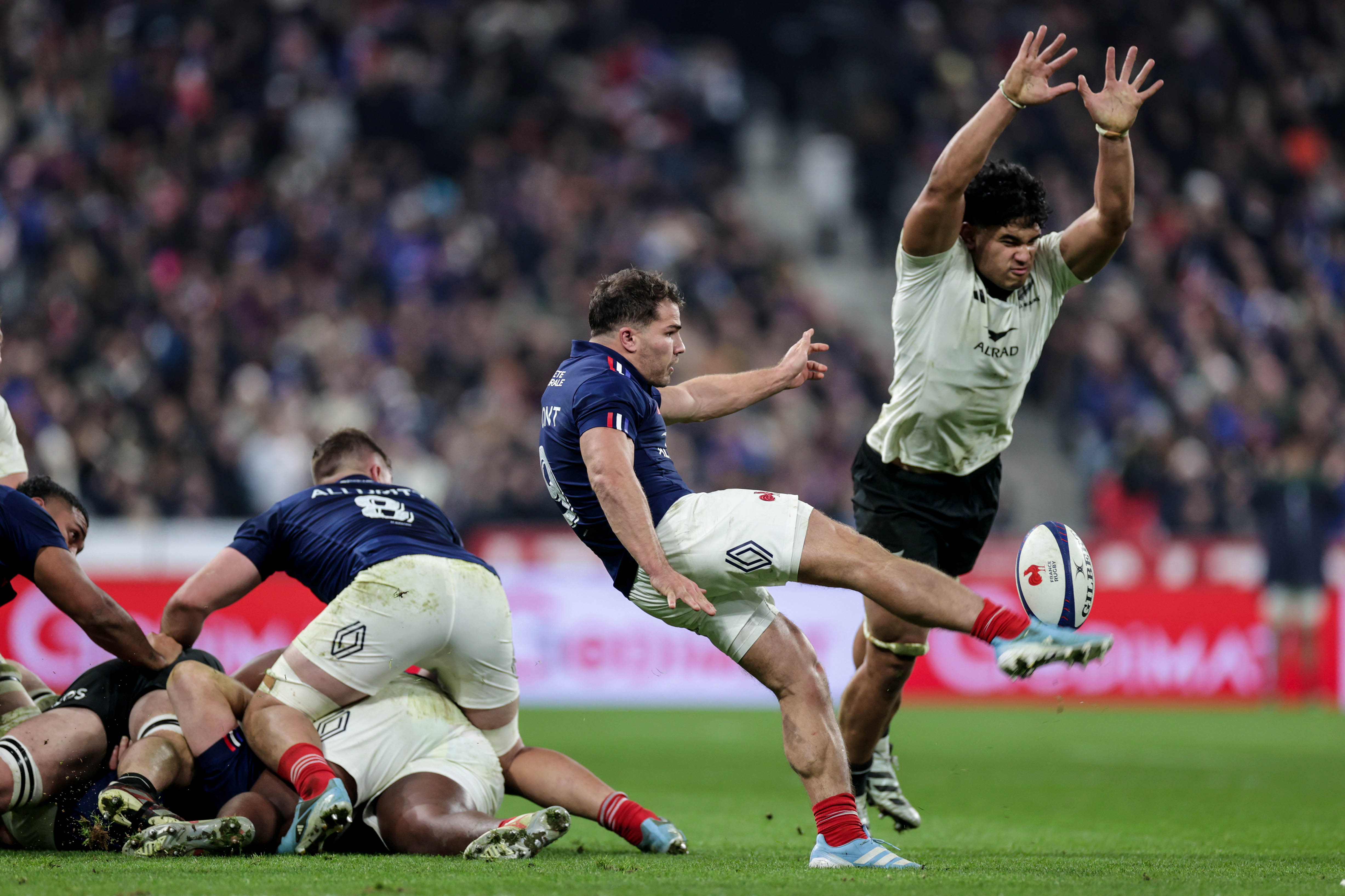 France's Antoine Dupont attempts to kick past New Zealand's Wallace Sititi during the 2024 Autumn Nations Series match in Paris.