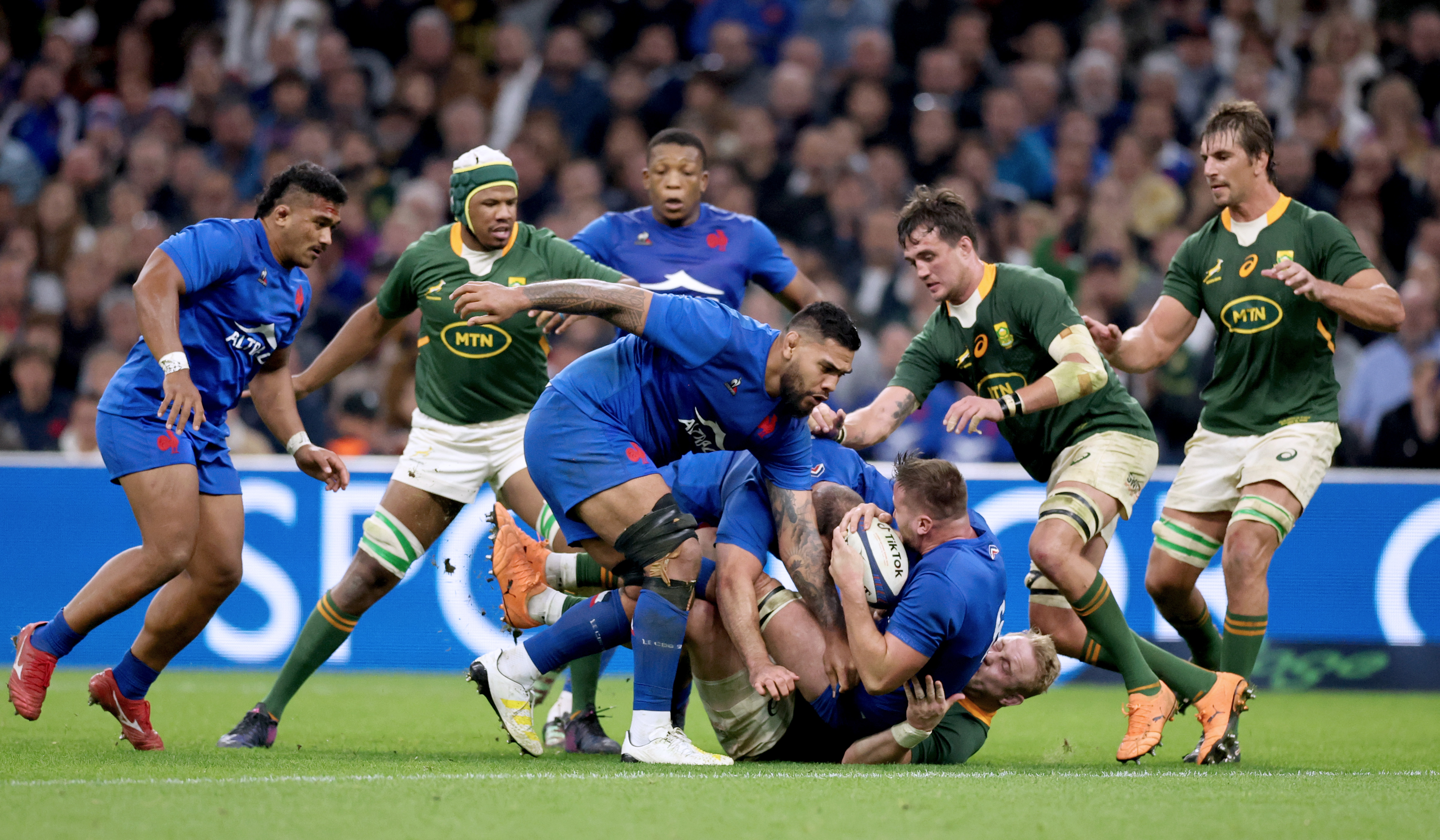 France’s Romain Taofifenua and Anthony Jelonch tackled by Vincent Koch of South Africa