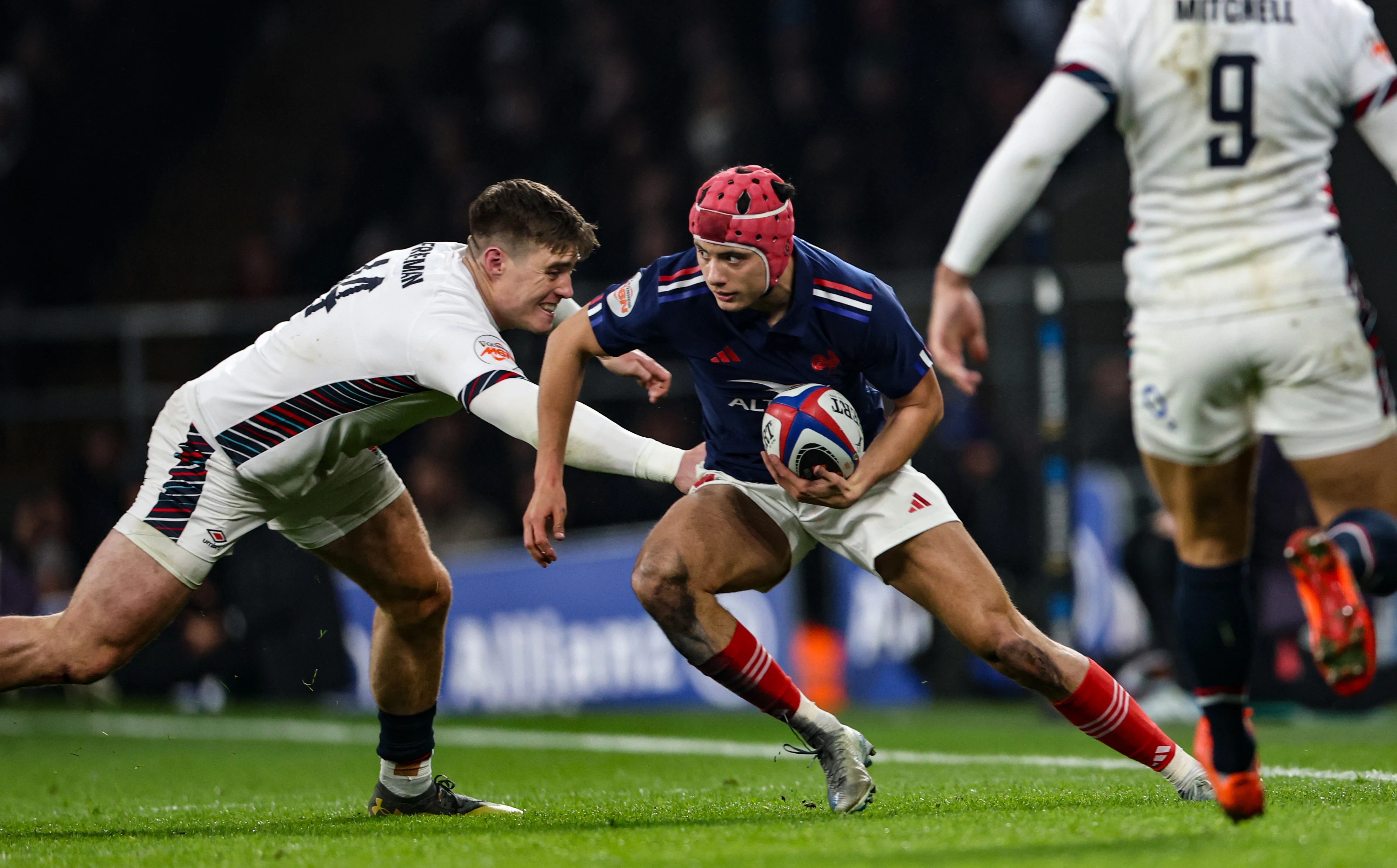 France's Louis Bielle-Biarrey is tackled by England's Tommy Freeman during the 2025 Championship match.