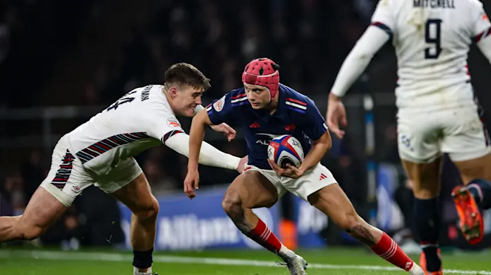France's Louis Bielle-Biarrey is tackled by England's Tommy Freeman during the 2025 Championship match.
