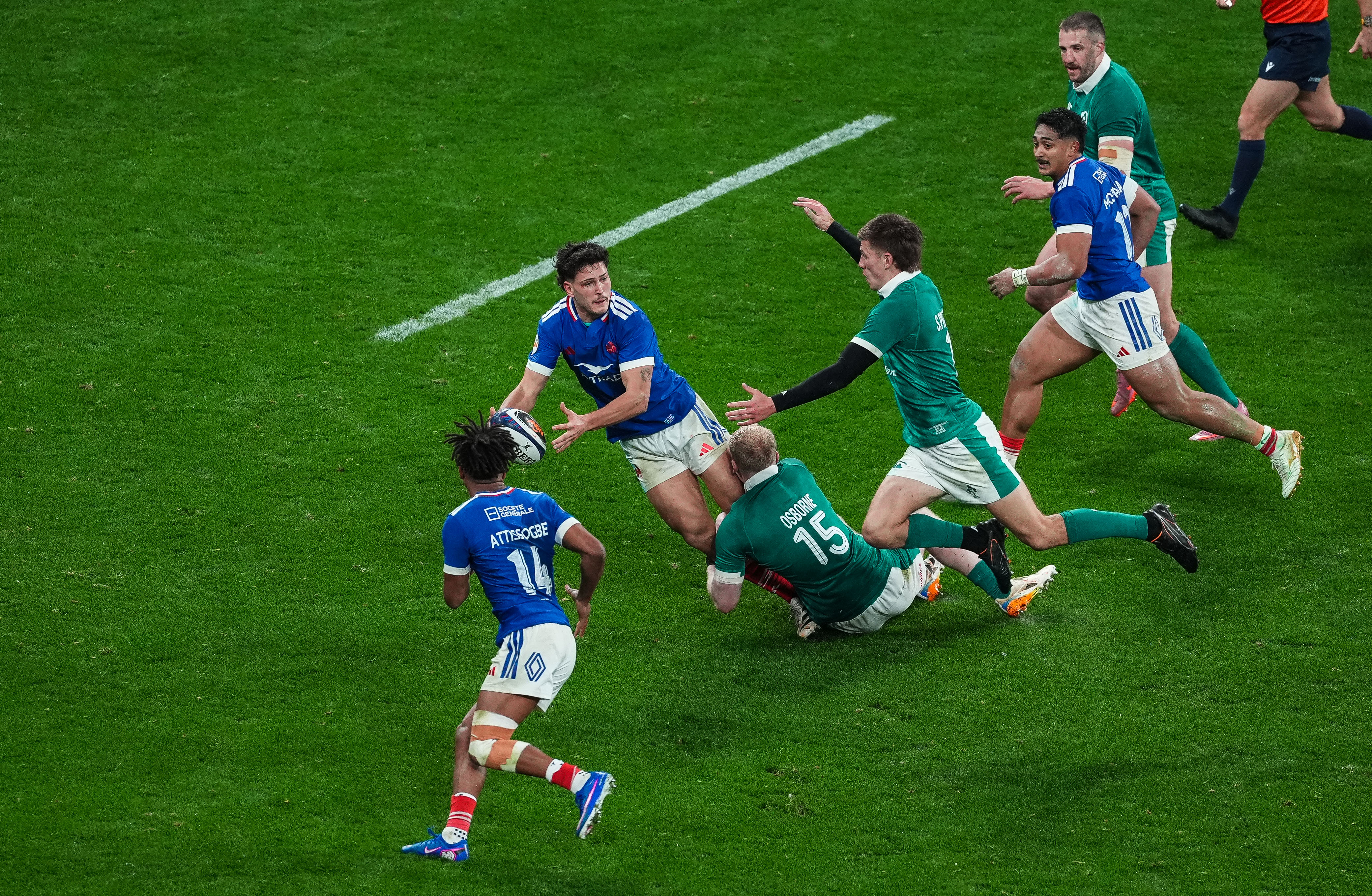 France's Nicolas Depoortere offloads to Theo Attissogbe after being tackled by Ireland's Jamie Osborne during the 2026 Guinness Six Nations Championship Round 1 game between France and Ireland in Stade de France, Paris, France, Thursday, February 5, 2026 (Photo by Dave Winter / Inpho)