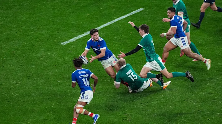 France's Nicolas Depoortere offloads to Theo Attissogbe after being tackled by Ireland's Jamie Osborne during the 2026 Guinness Six Nations Championship Round 1 game between France and Ireland in Stade de France, Paris, France, Thursday, February 5, 2026 (Photo by Dave Winter / Inpho)