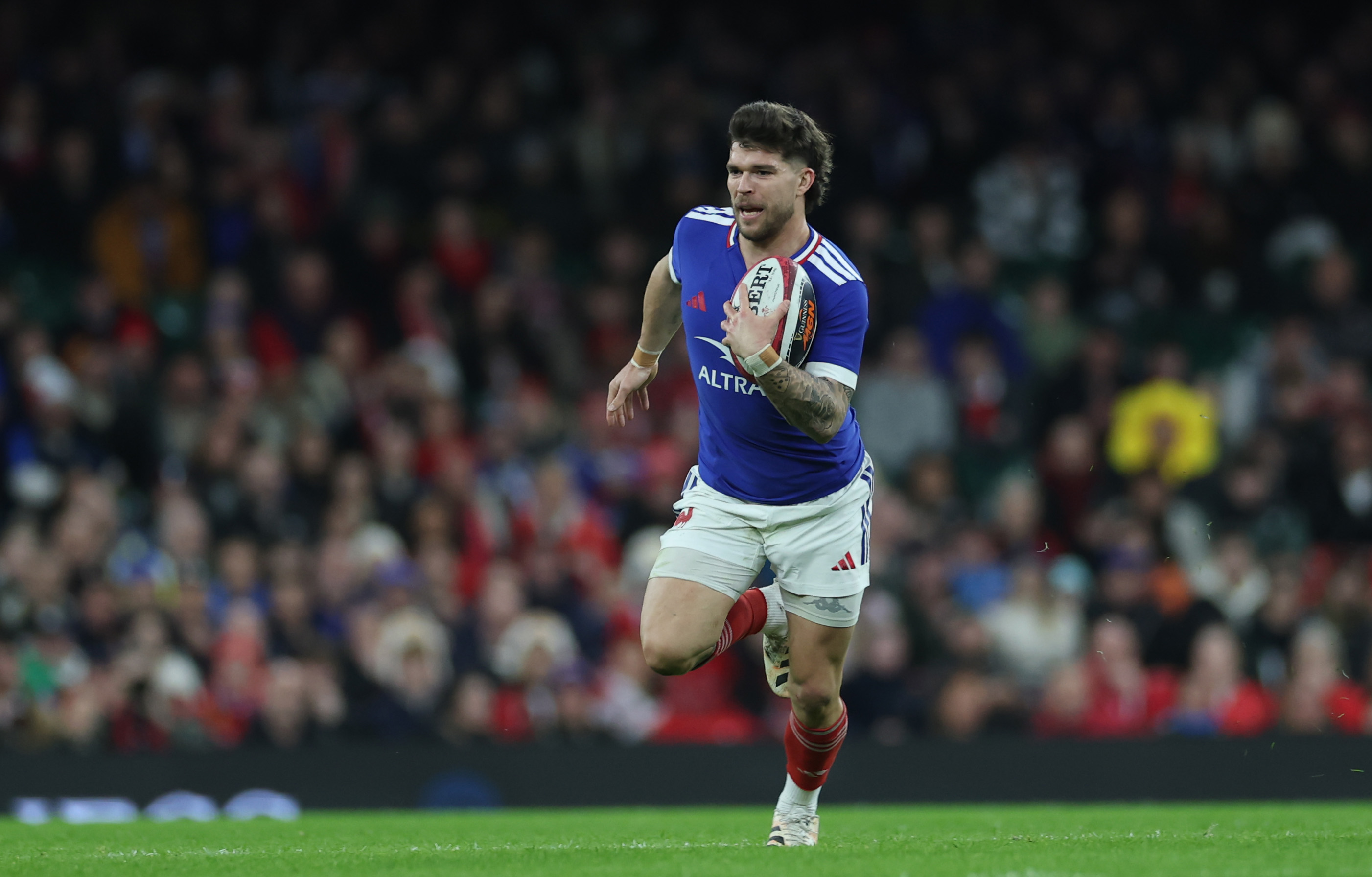 Matthieu Jalibert runs with the ball against Wales in round two of the 2026 Championship.