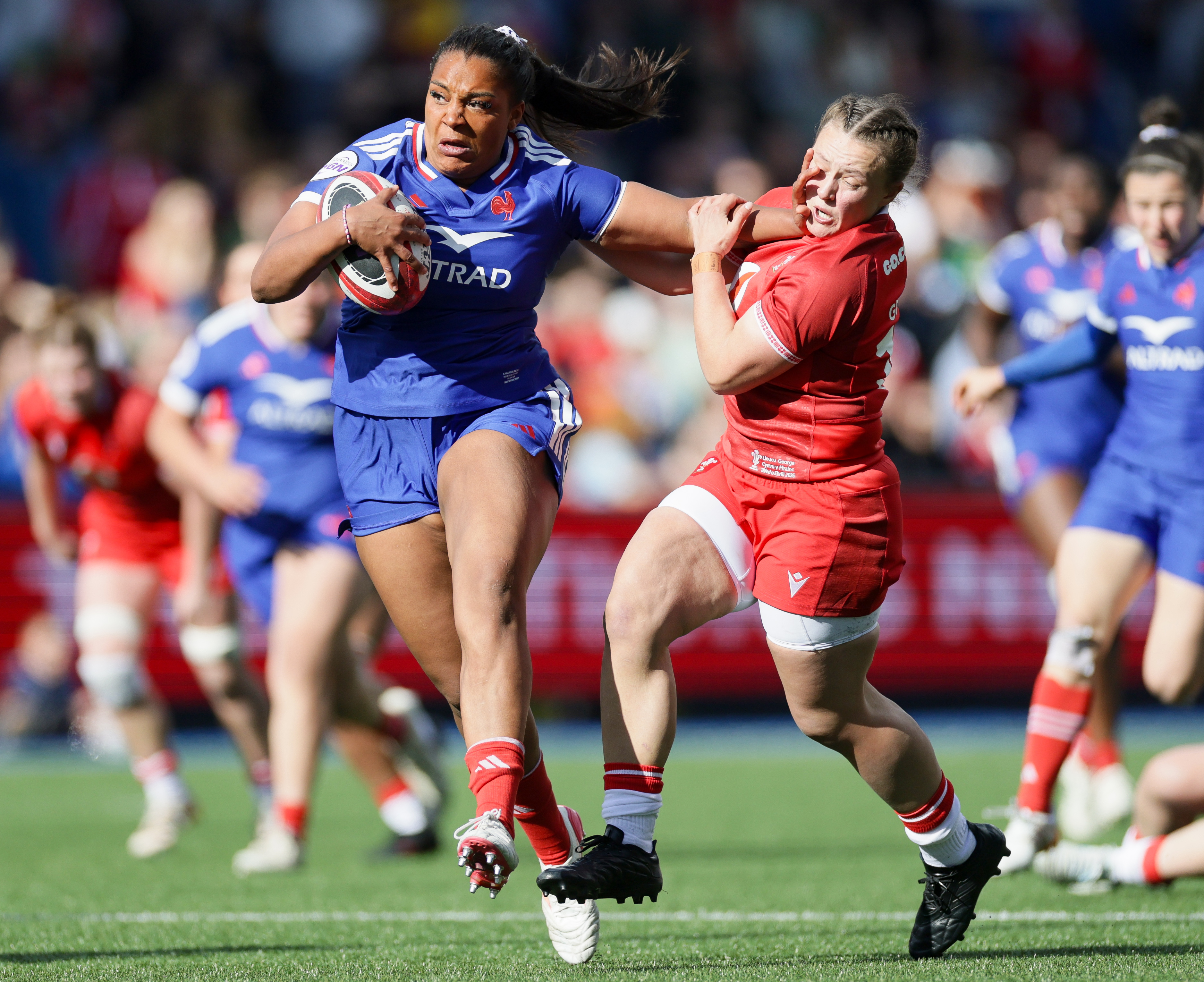 France's Ambre Mwayembe hands off Wales' Lleucu George during the 2026 Guinness Women's Six Nations Championship Round 2 game between Wales and France in Cardiff Arms Park, Cardiff, Wales, Saturday, April 18, 2026 (Photo by Laszlo Geczo / Inpho)